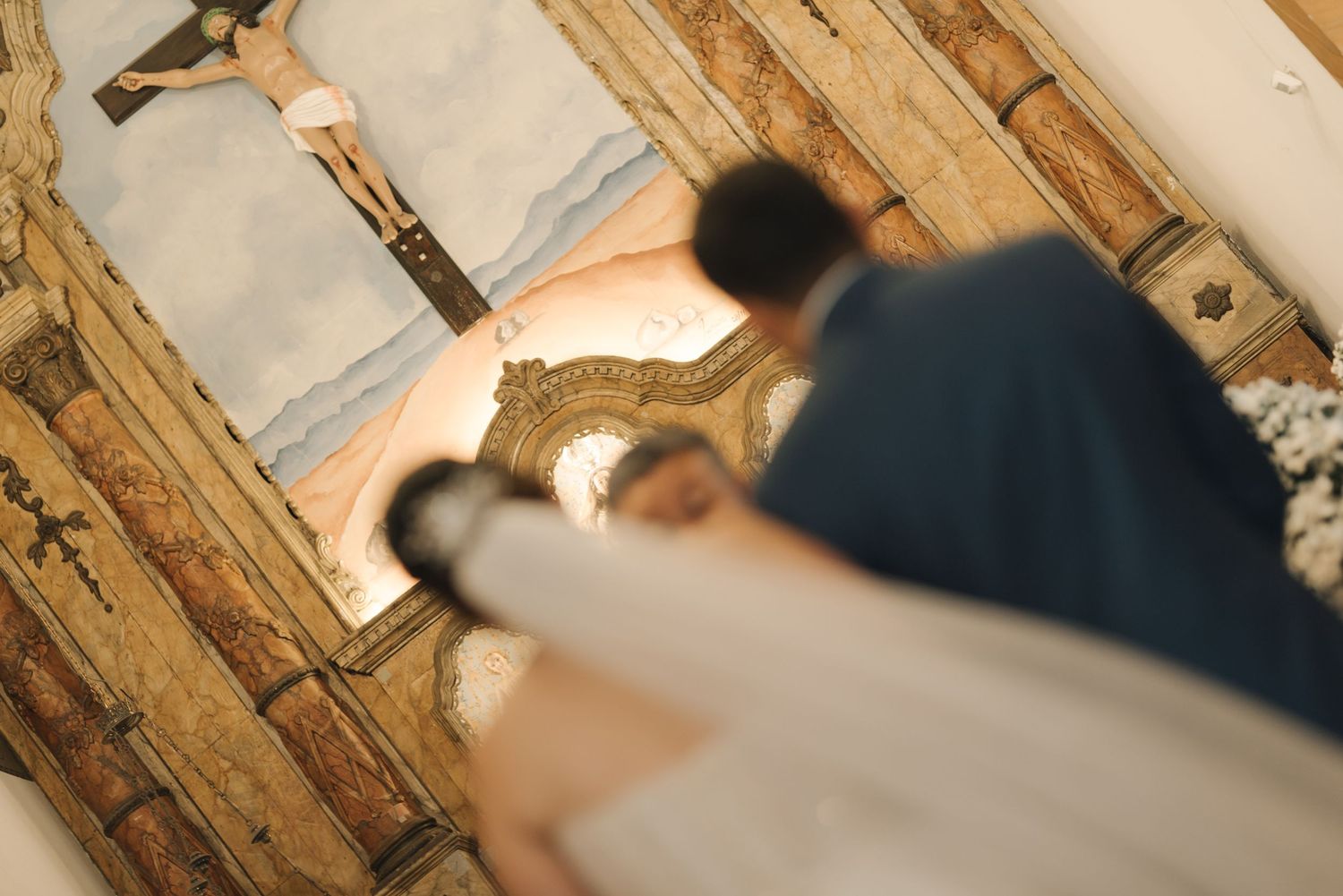 An intimate dance moment between bride and groom captured from above.