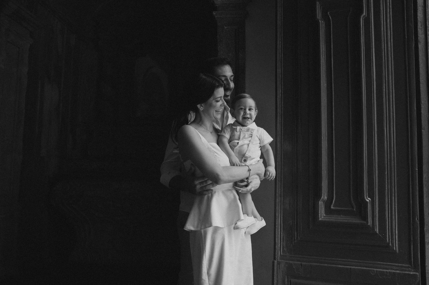 Black and white photo series showing tender moments between a couple in formal wedding attire.
