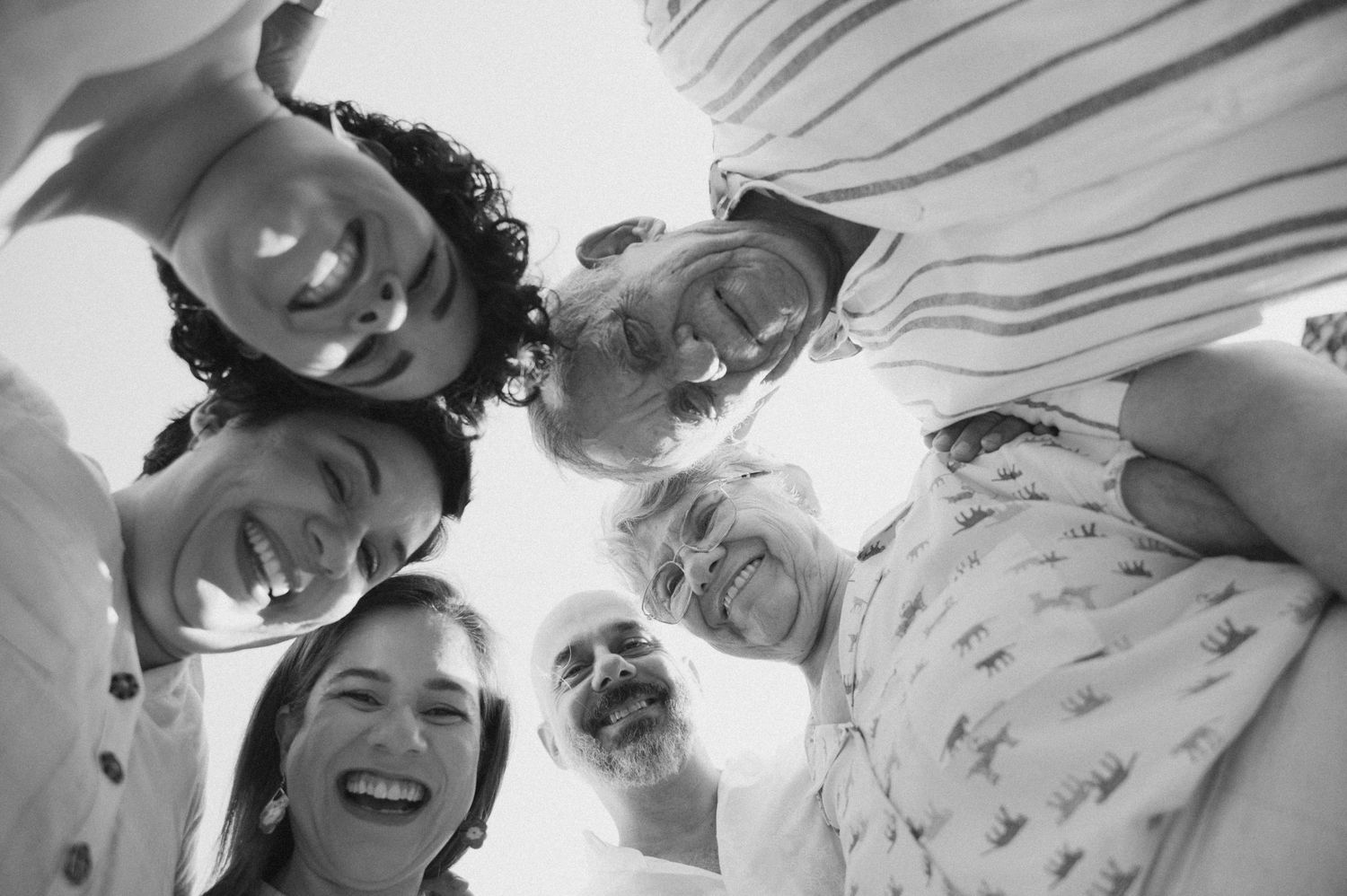A black and white photo collage of a happy couple sharing intimate moments and laughter together.