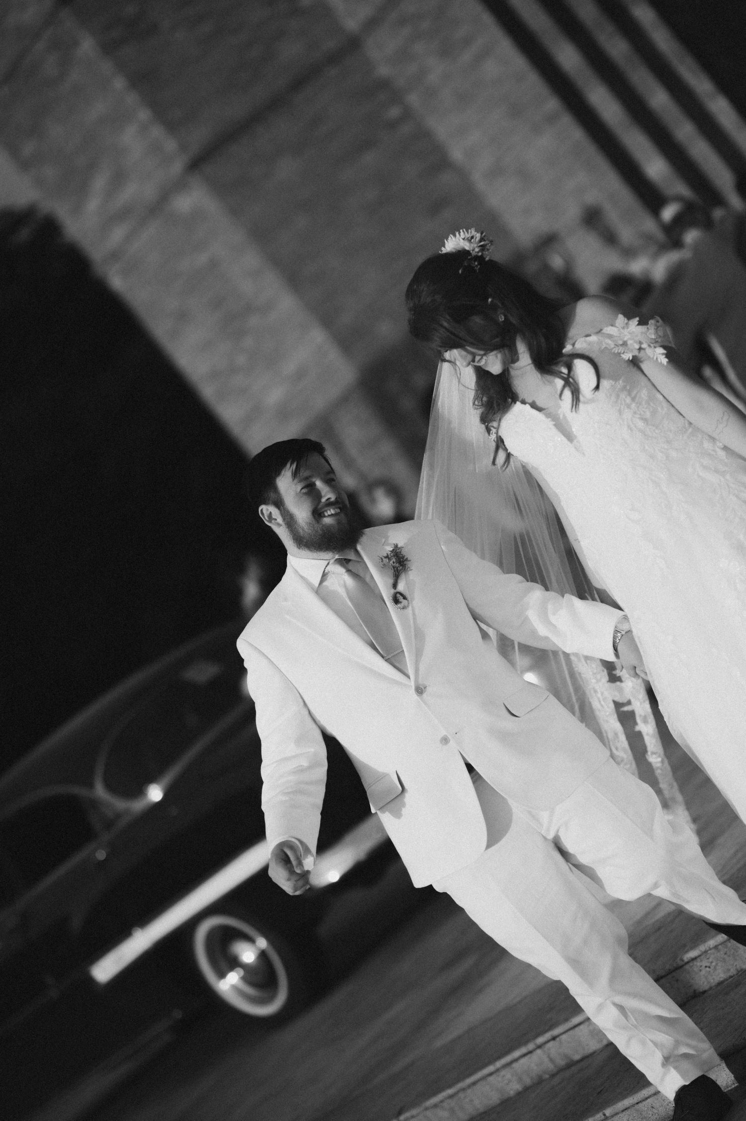 A sequence of black and white photos showing a couple's first dance at their wedding reception.