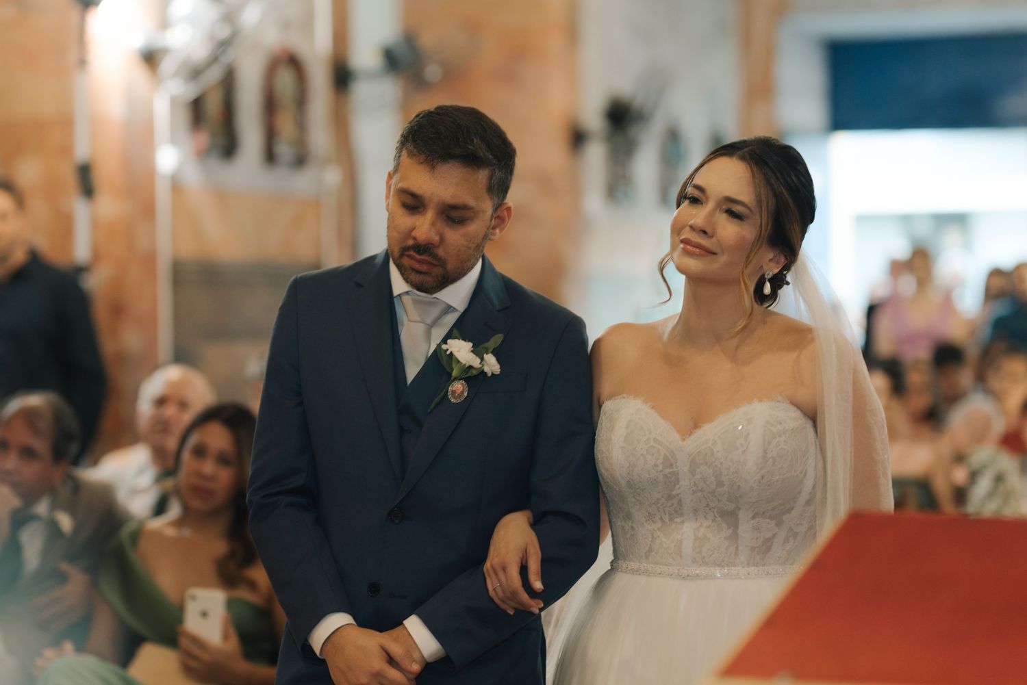 A bride and groom share a joyful moment during their wedding ceremony.