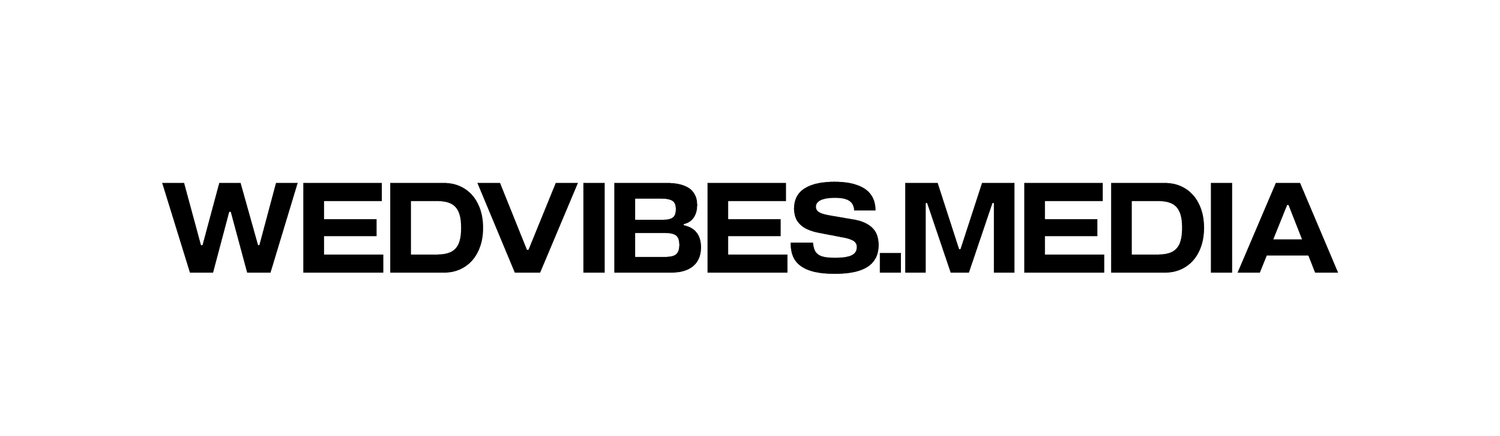Black and white logo of WedVibes.Media, a wedding media brand, displayed in bold sans-serif typography.