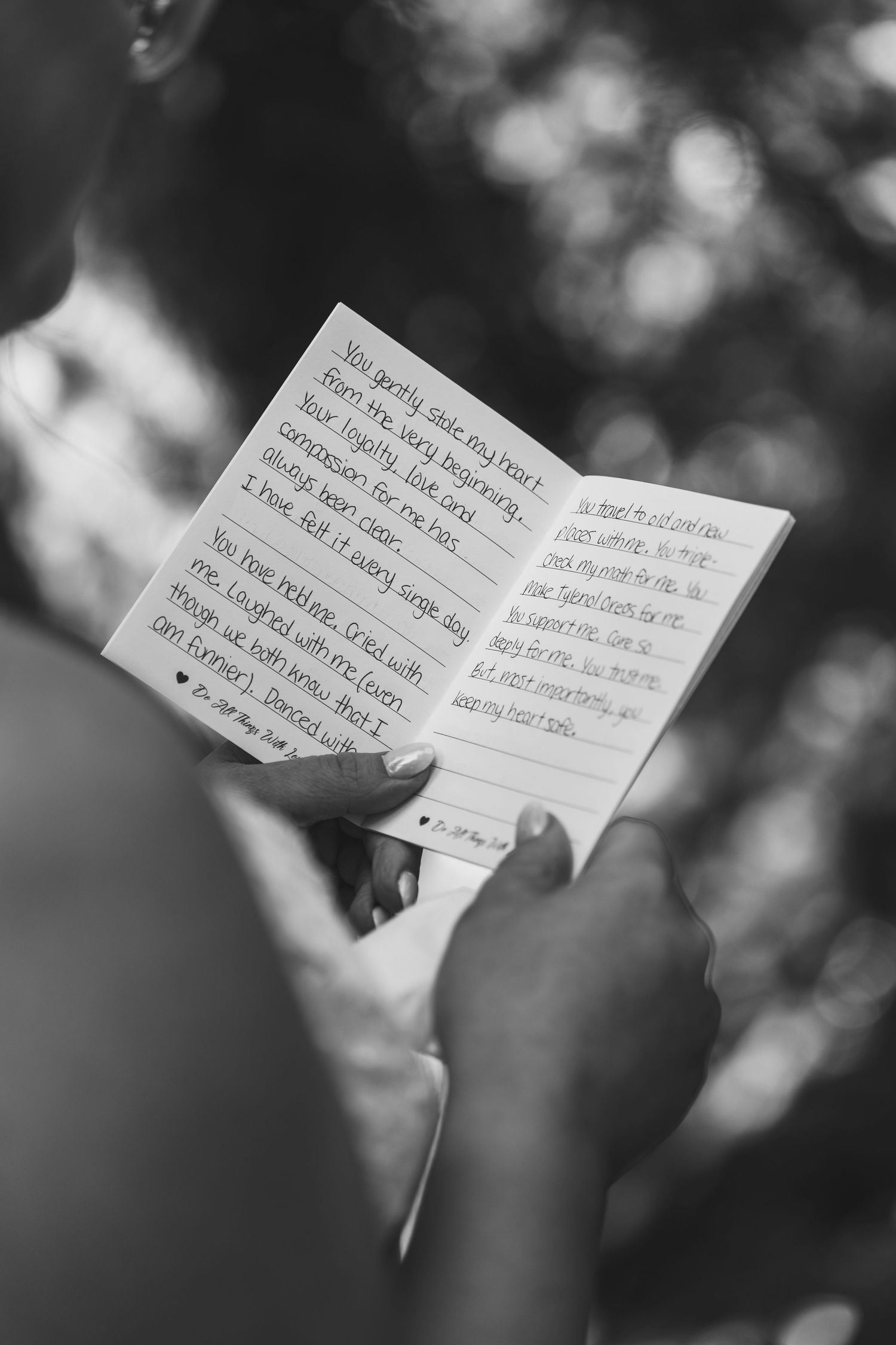 A sequence of black and white photos showing hands holding handwritten notes against a blurred background.