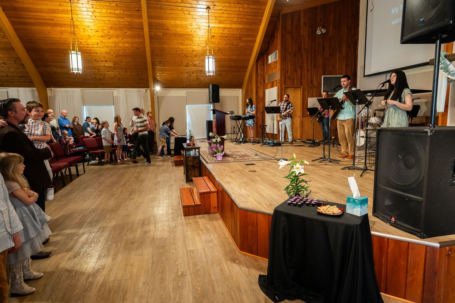 view from one side of the Crossroads Morgantown auditorium, showing seated church members listening to Pastor Chris's sermon on a Sunday