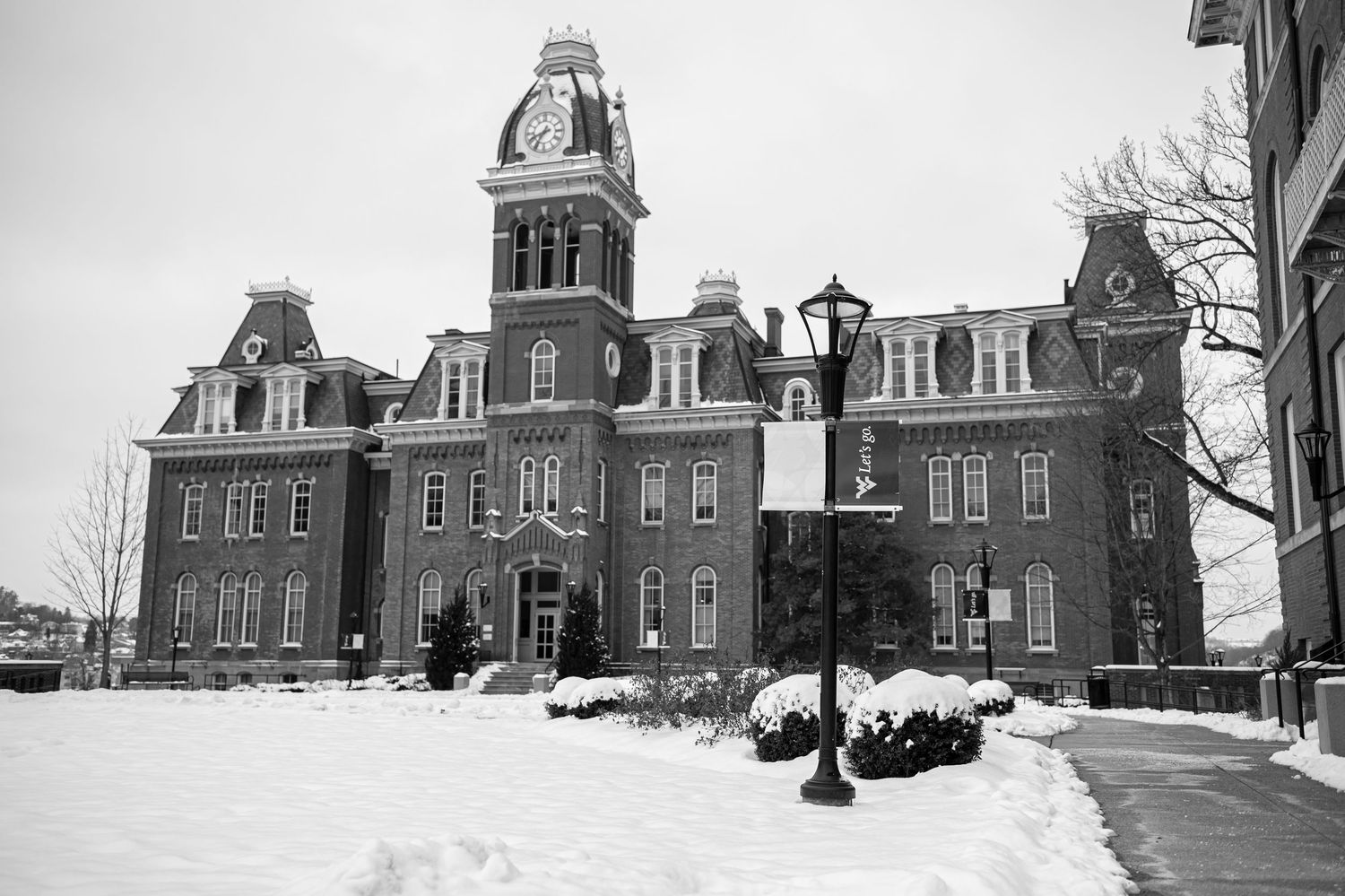 Black and white image of WVU's Woodburn Hall in the snow; Morgantown, WV