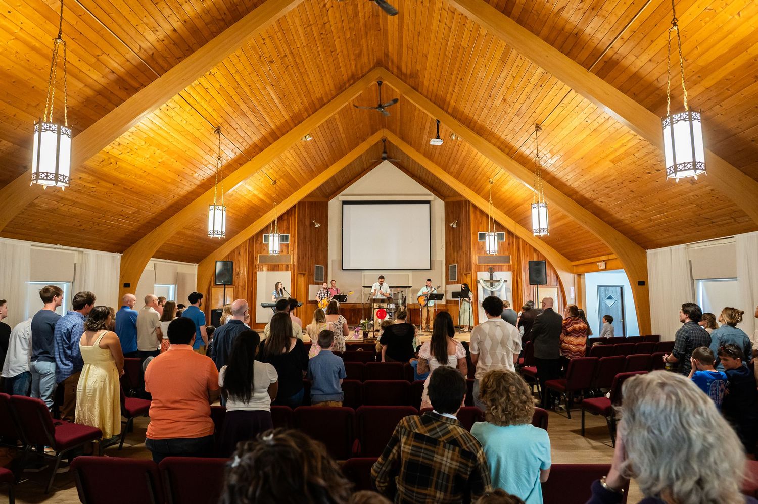 a view of the Crossroads church auditorium filled with standing attendees during Sunday morning church service in downtown Morgantown, WV
