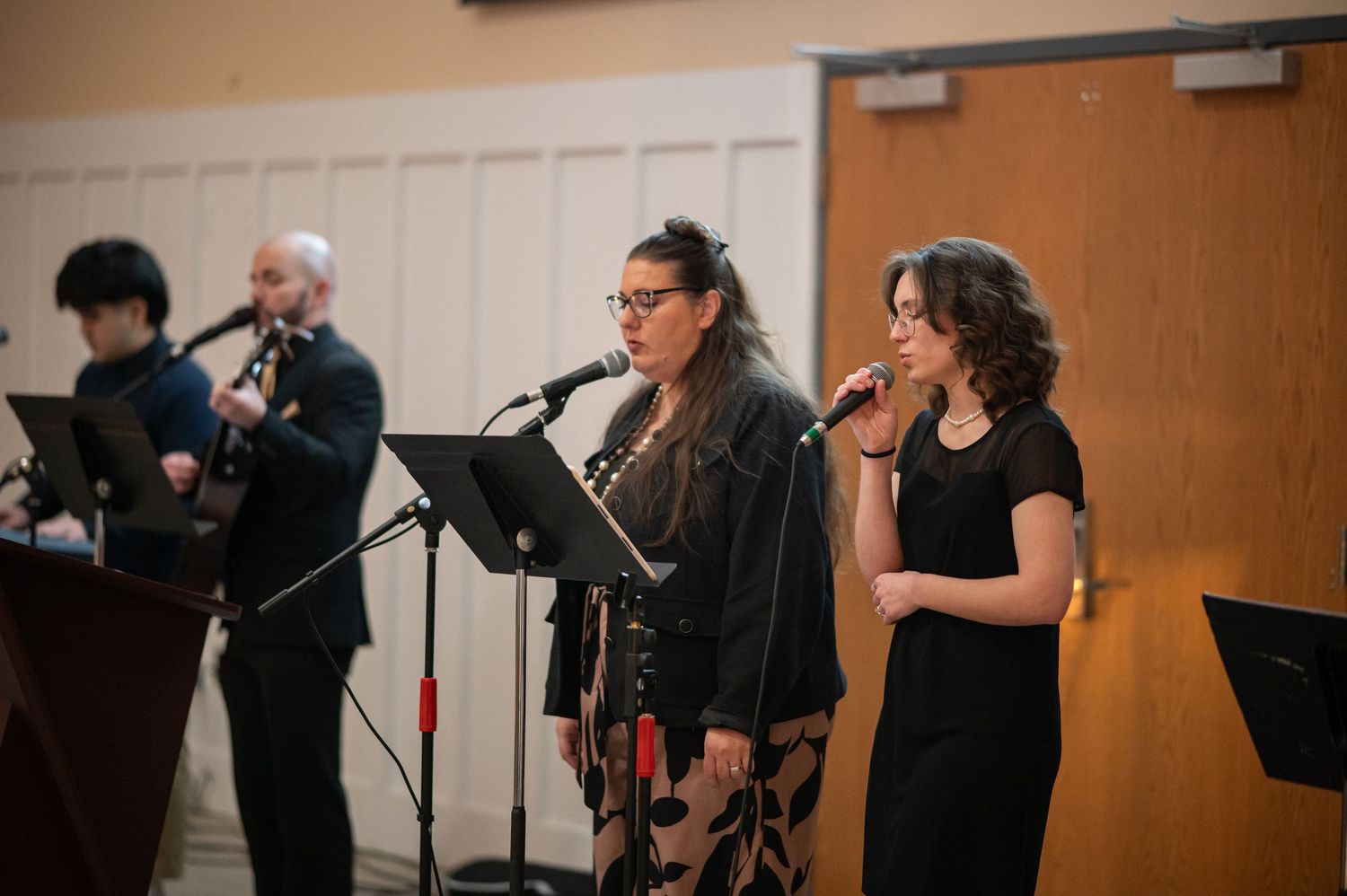 Members from Crossroads Fairmont and Morgantown lead worship together at an event