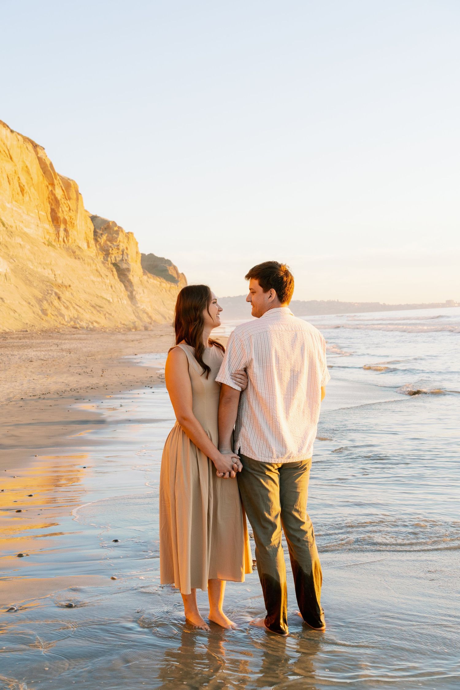 Couple's professional beach photoshoot at Torrey Pines Beach in San Diego, California