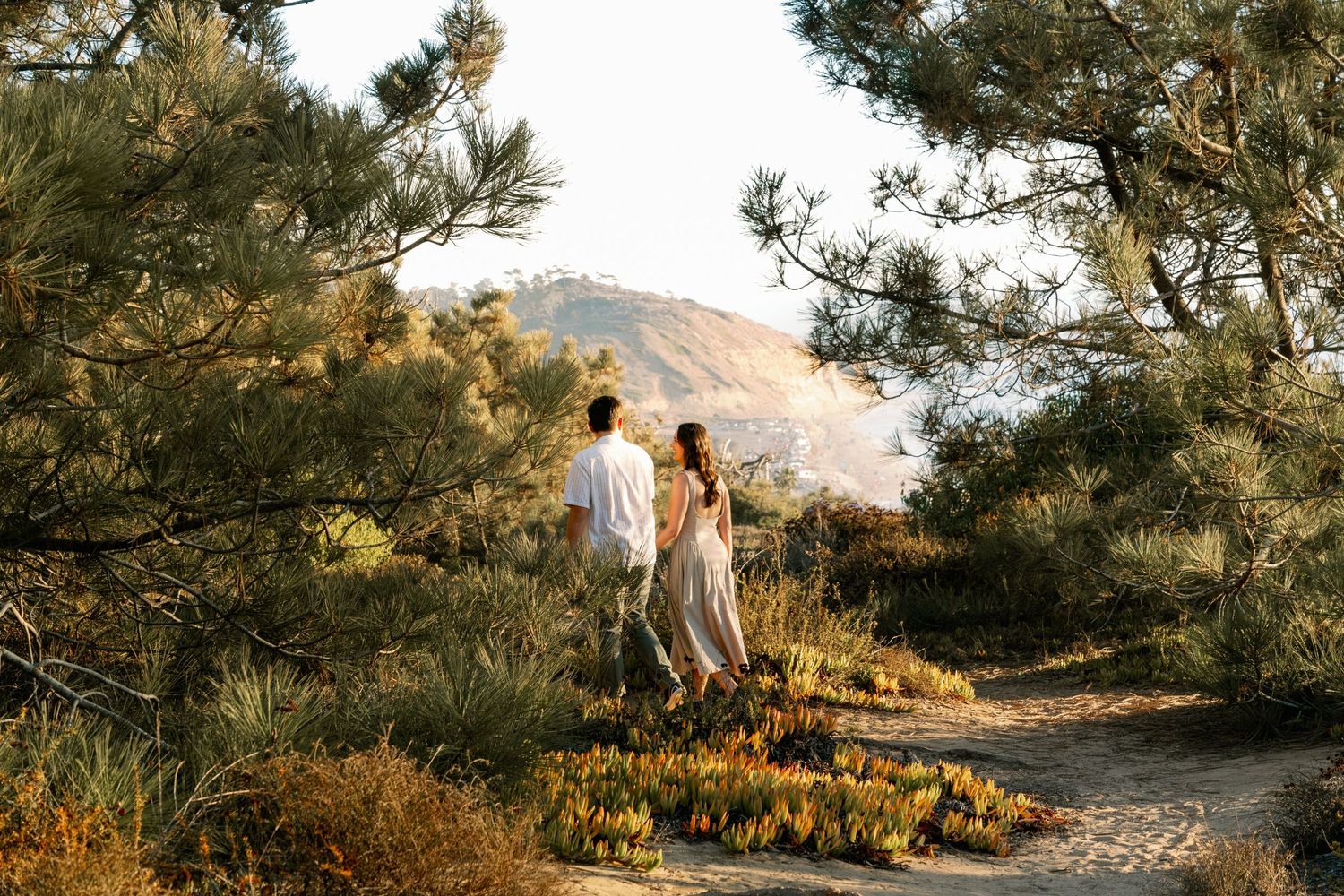 Couple's professional beach photoshoot at Torrey Pines Beach in San Diego, California