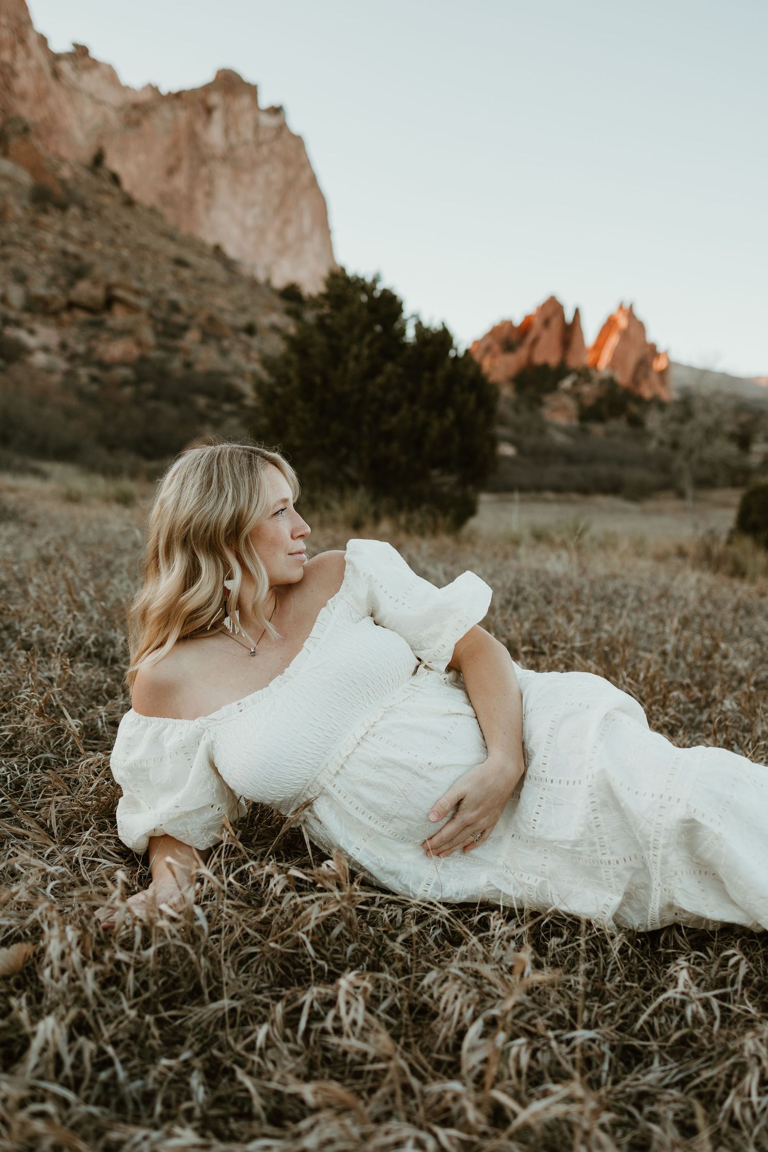 Elegant white dress portrait session at Garden of the Gods in Colorado during golden hour.