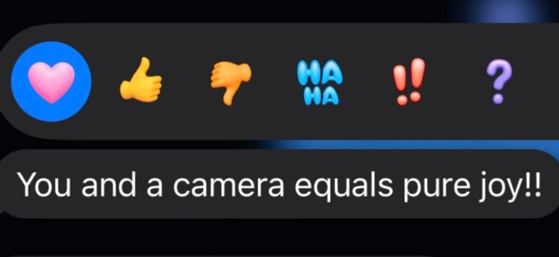 Reaction emojis with heart, thumbs up, thumbs down, haha, exclamation, and question mark on dark background.