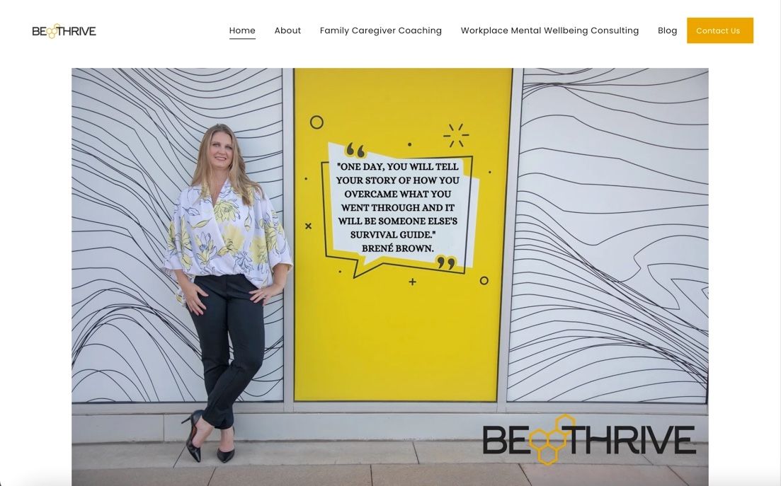 Person standing next to yellow motivational wall with white wavy pattern design.