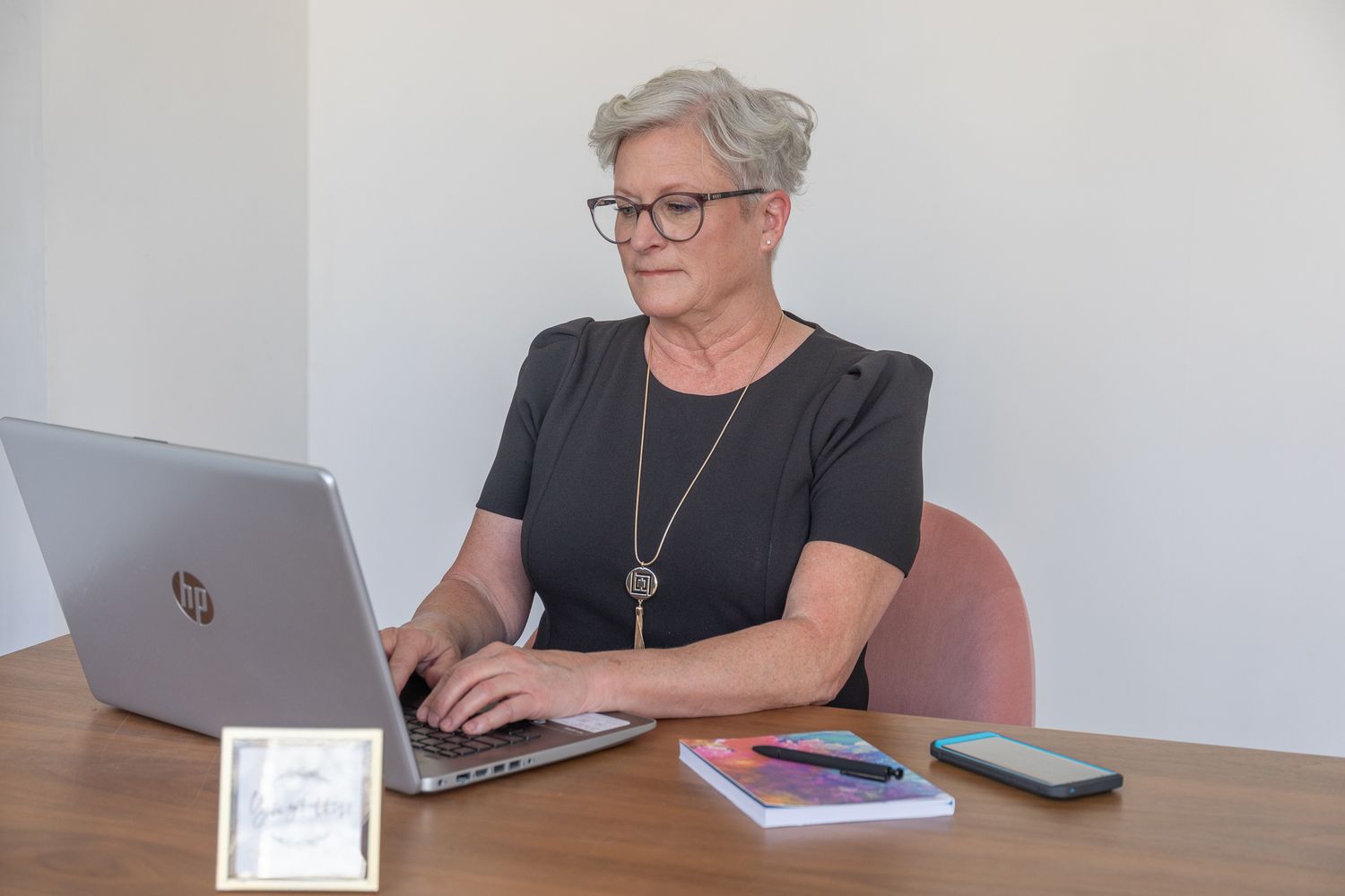 Brand Photography of a Virtual Assistant, looking confident and in control.