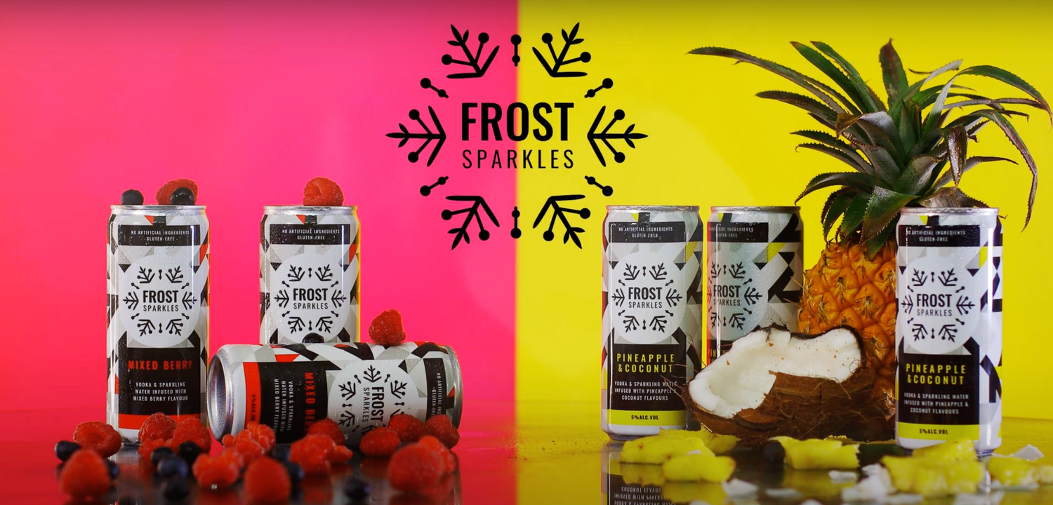 Frost Sparkles canned beverages displayed with fresh tropical fruits on colorful backgrounds.