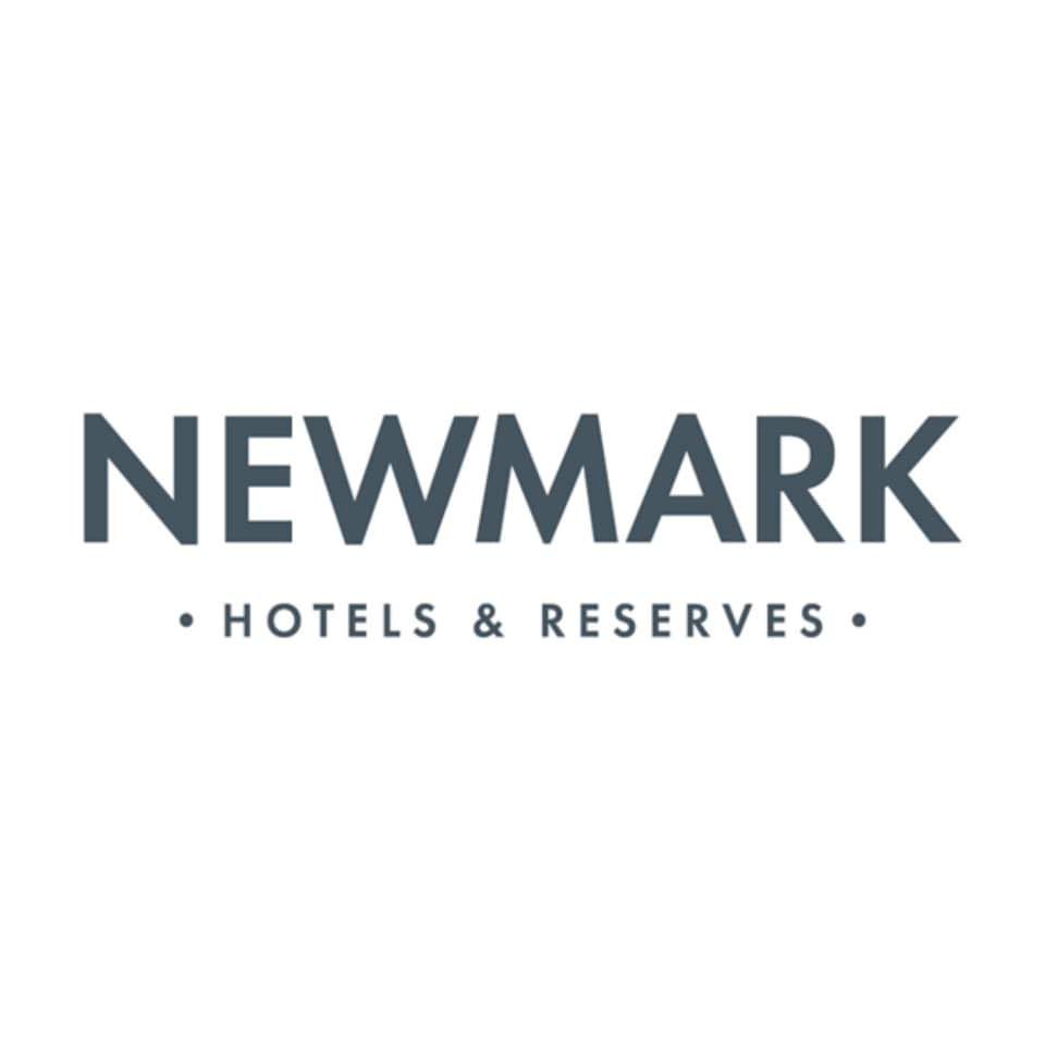 Newmark Hotels and Reserves logo in dark slate blue typography on a white background.