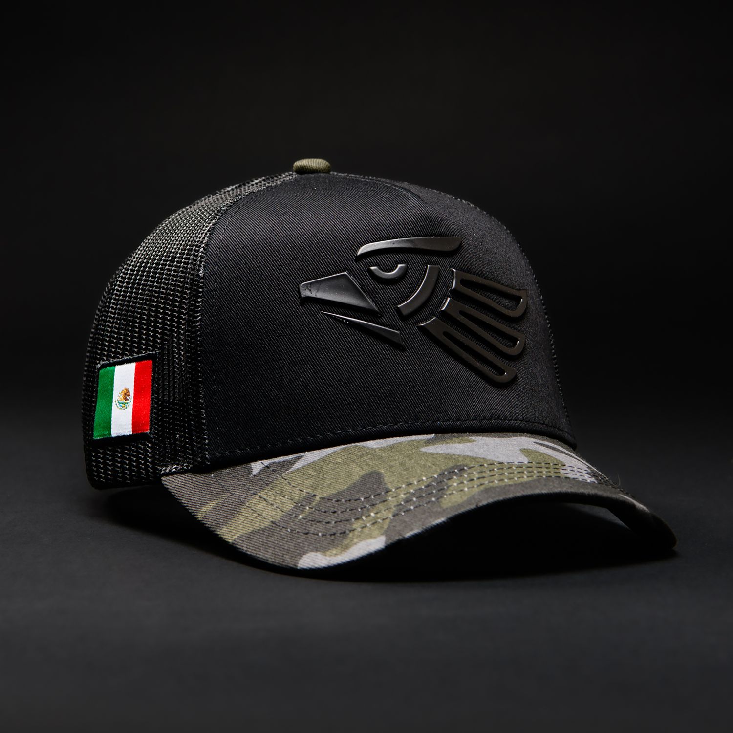 Black mesh baseball cap with Italian flag patch and camouflage brim featuring embossed dark logo design on front.