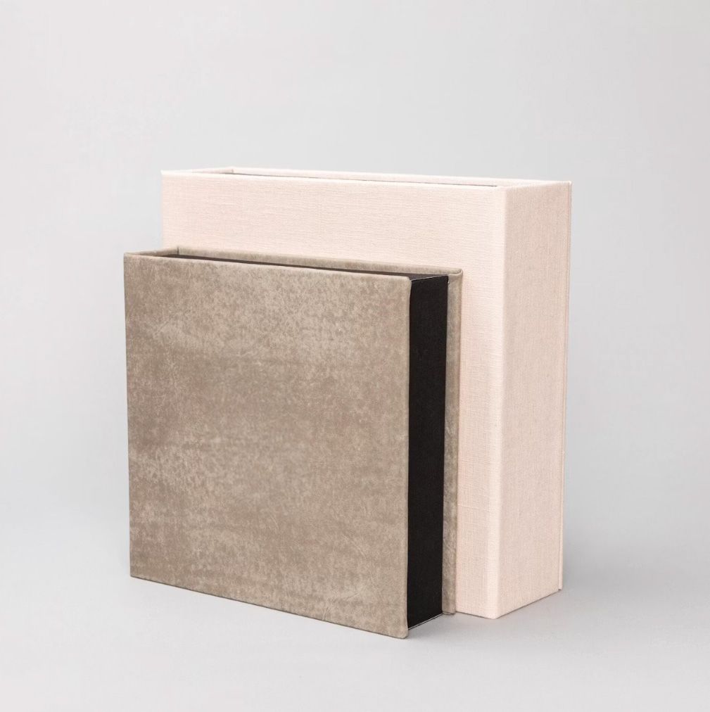 Elegant square keepsake box with taupe velvet cover and blush pink outer storage box on gray background.