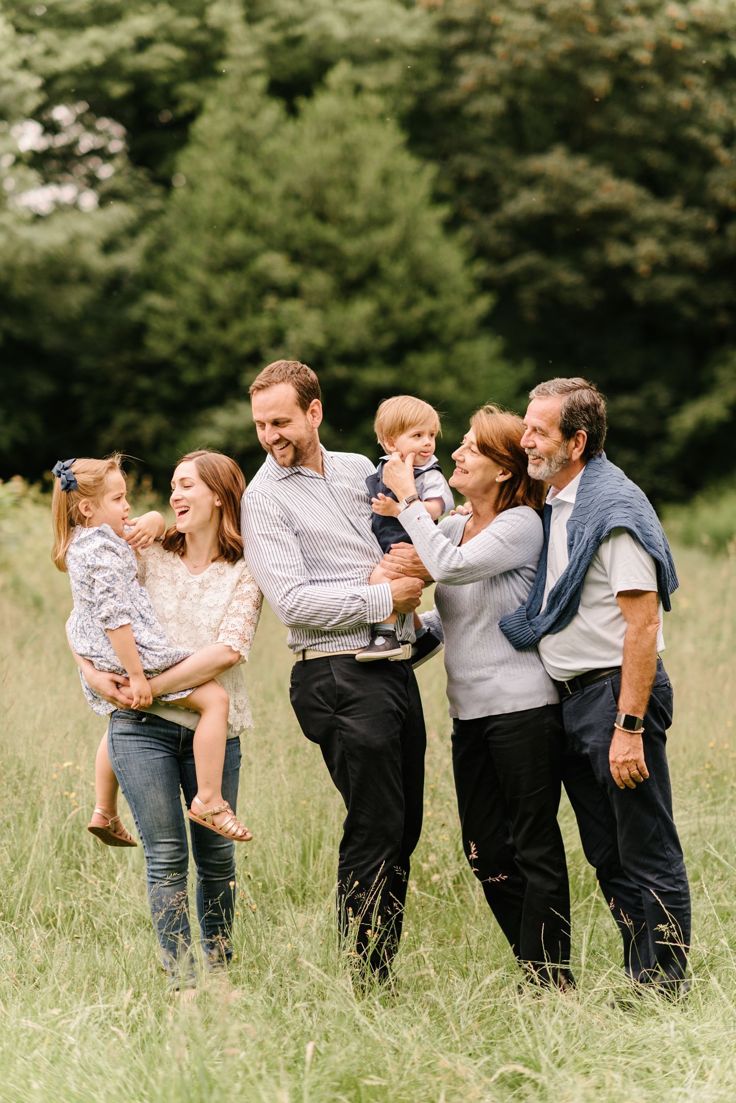 Outdoor family photo shoot with grandparents at Hampstead Heath in London.