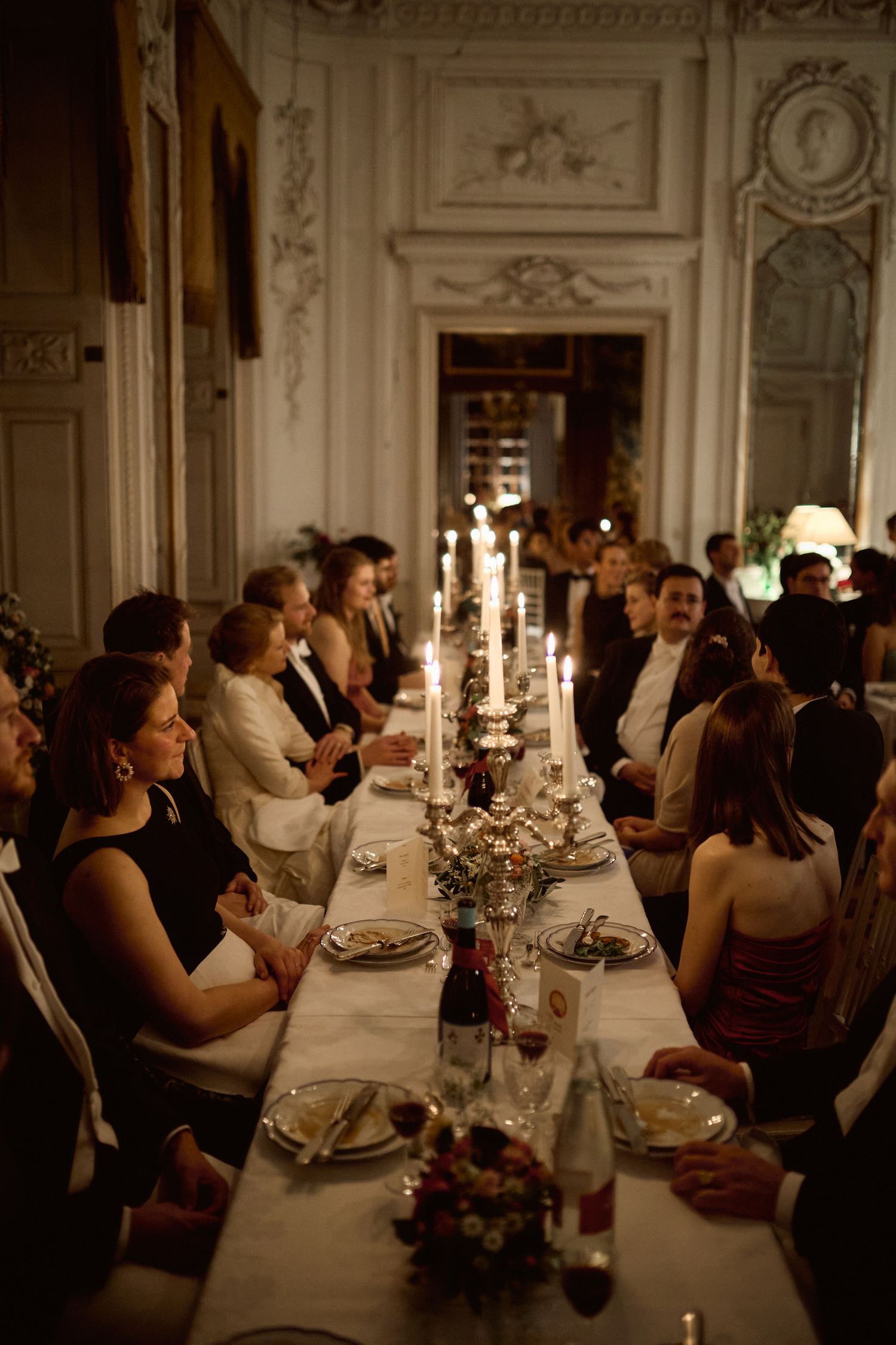 Candle-lit dinner in a family castle after a wedding. Elegant wedding photography Austria, Germany.