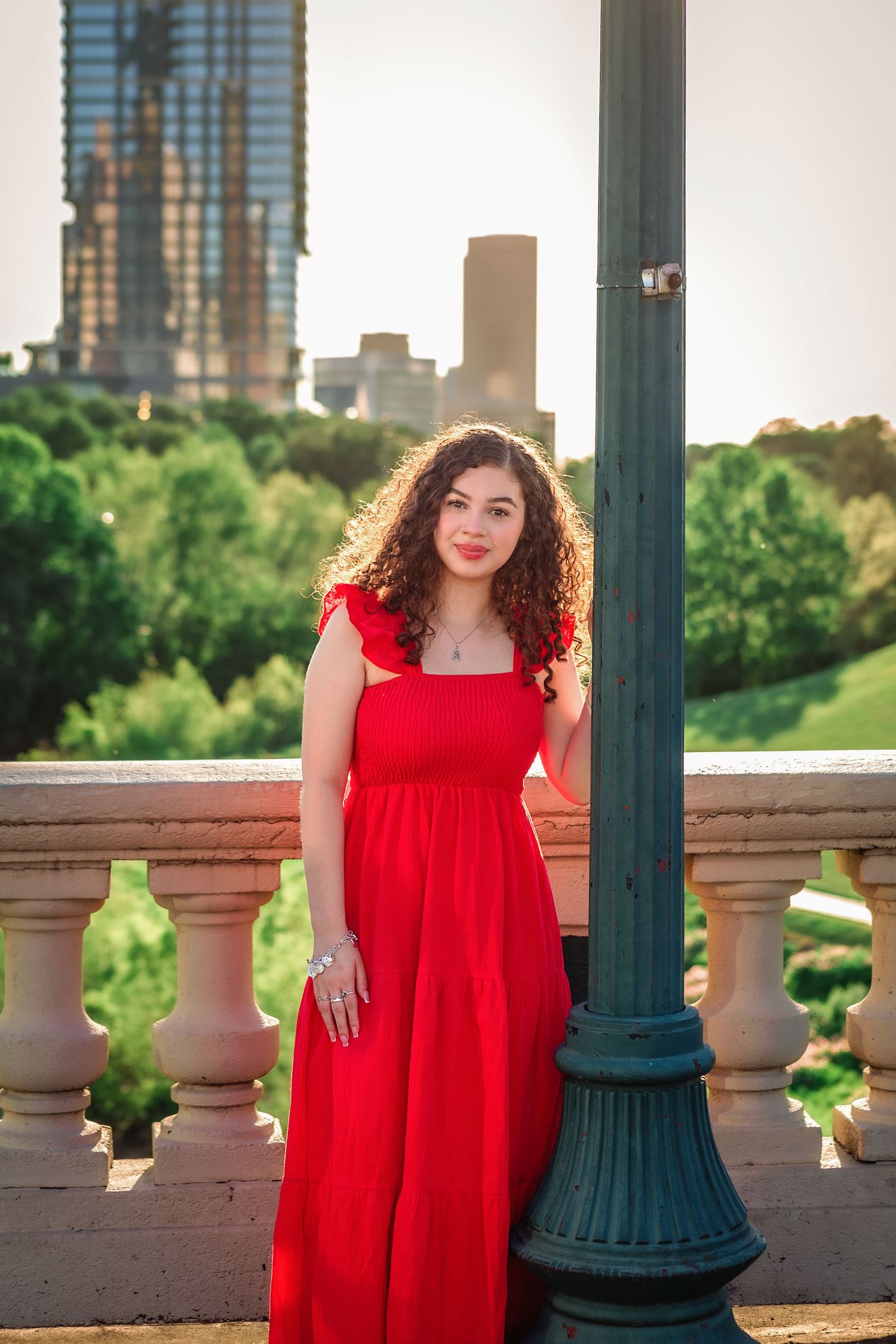 Senior girl posing with downtown skyline in the background