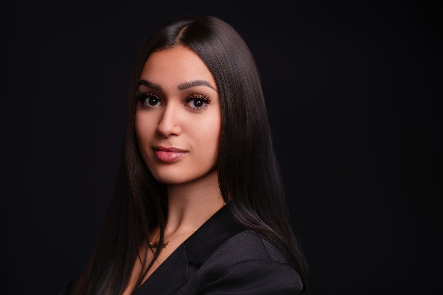 Dramatic portrait series against black background with professional studio lighting.
