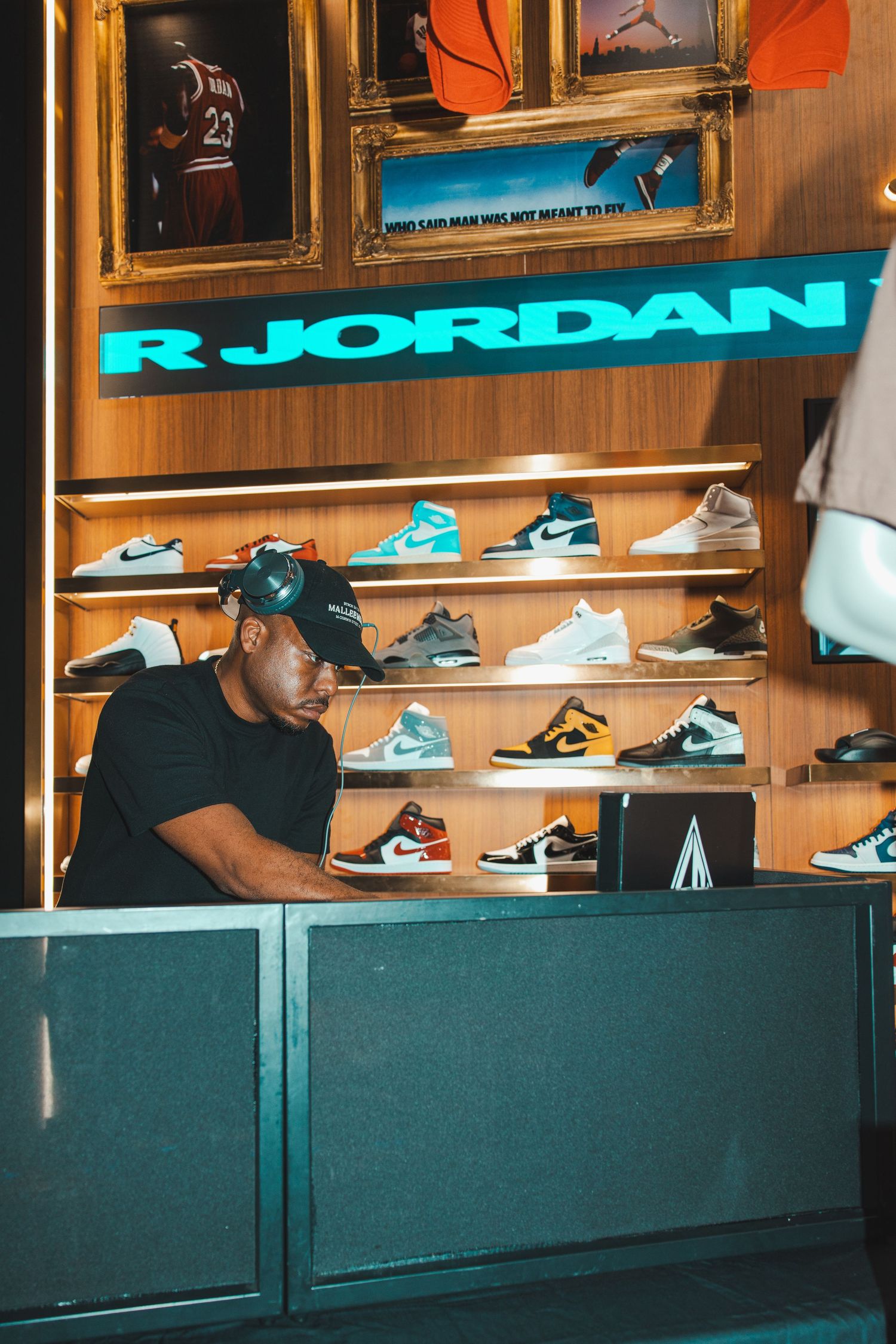 Interior of a Jordan brand store showing shelves of sneakers and retail displays.