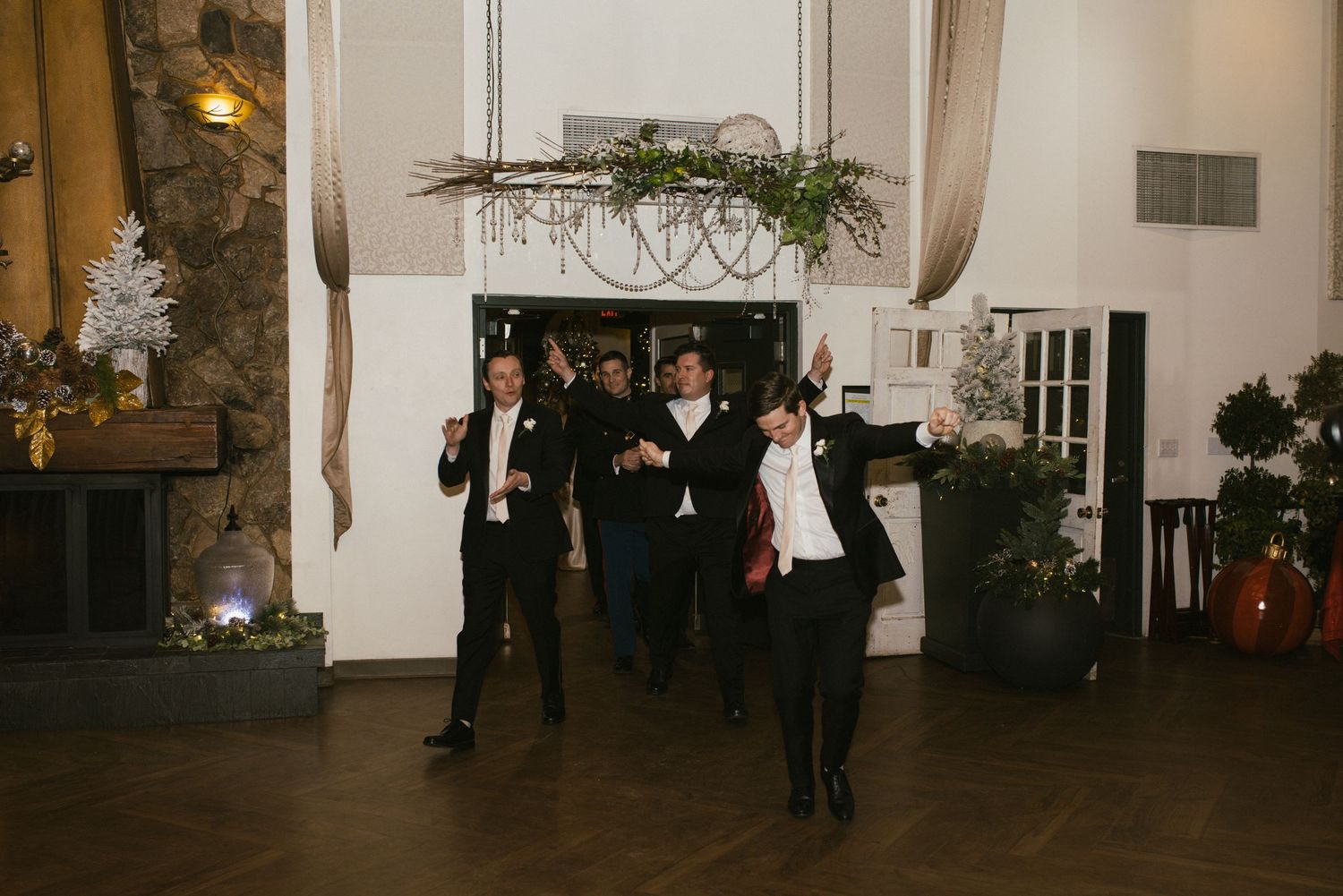 Interior view of an elegant wedding venue with stone walls and hardwood floors.