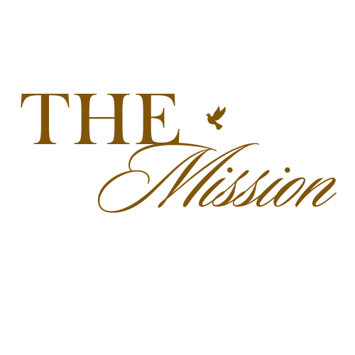 Gold text logo design reading 'The Mission' with decorative script and small bird detail.