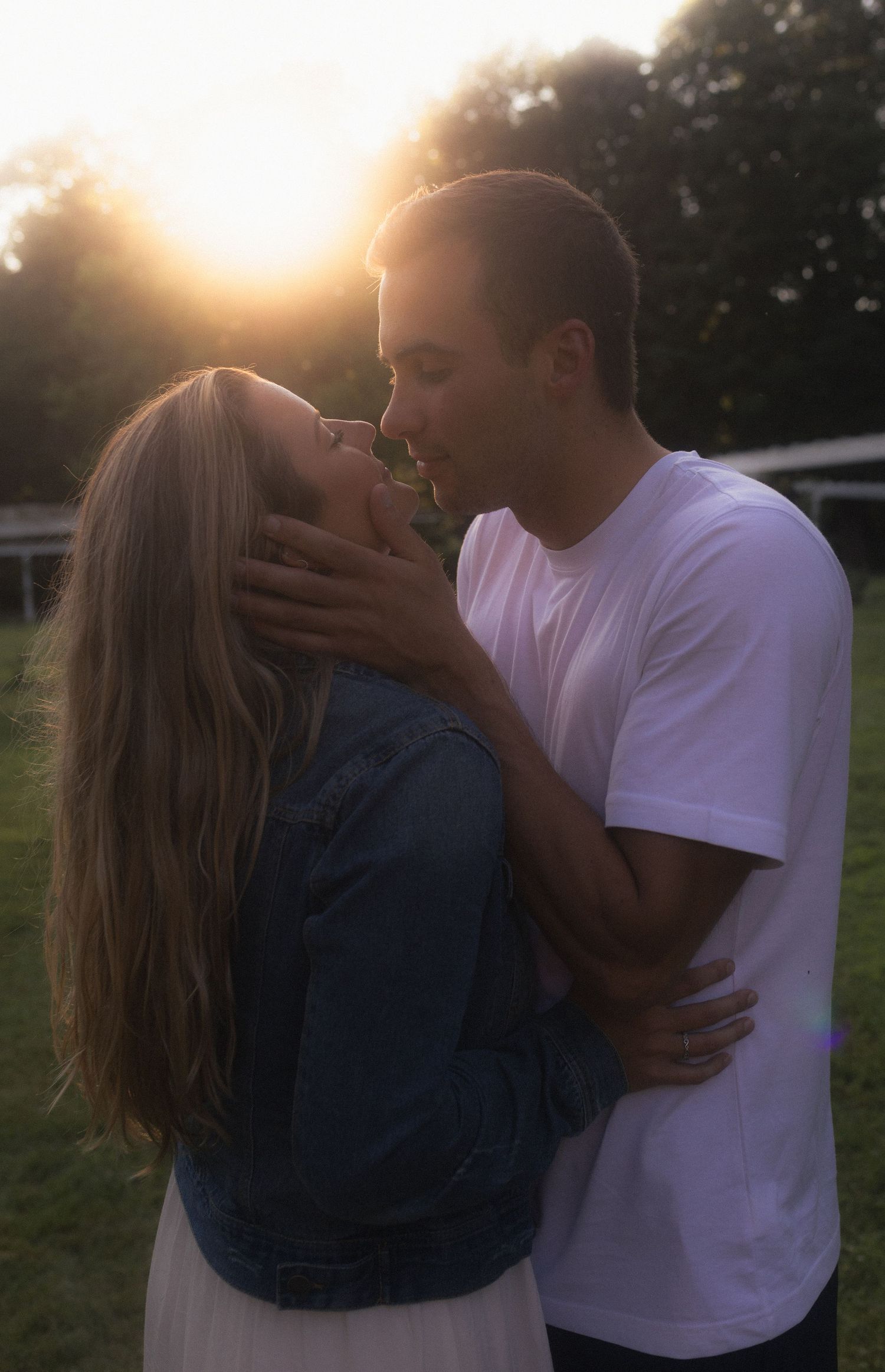 Sunset photoshoot sequence showing tender moments between a couple in casual attire.