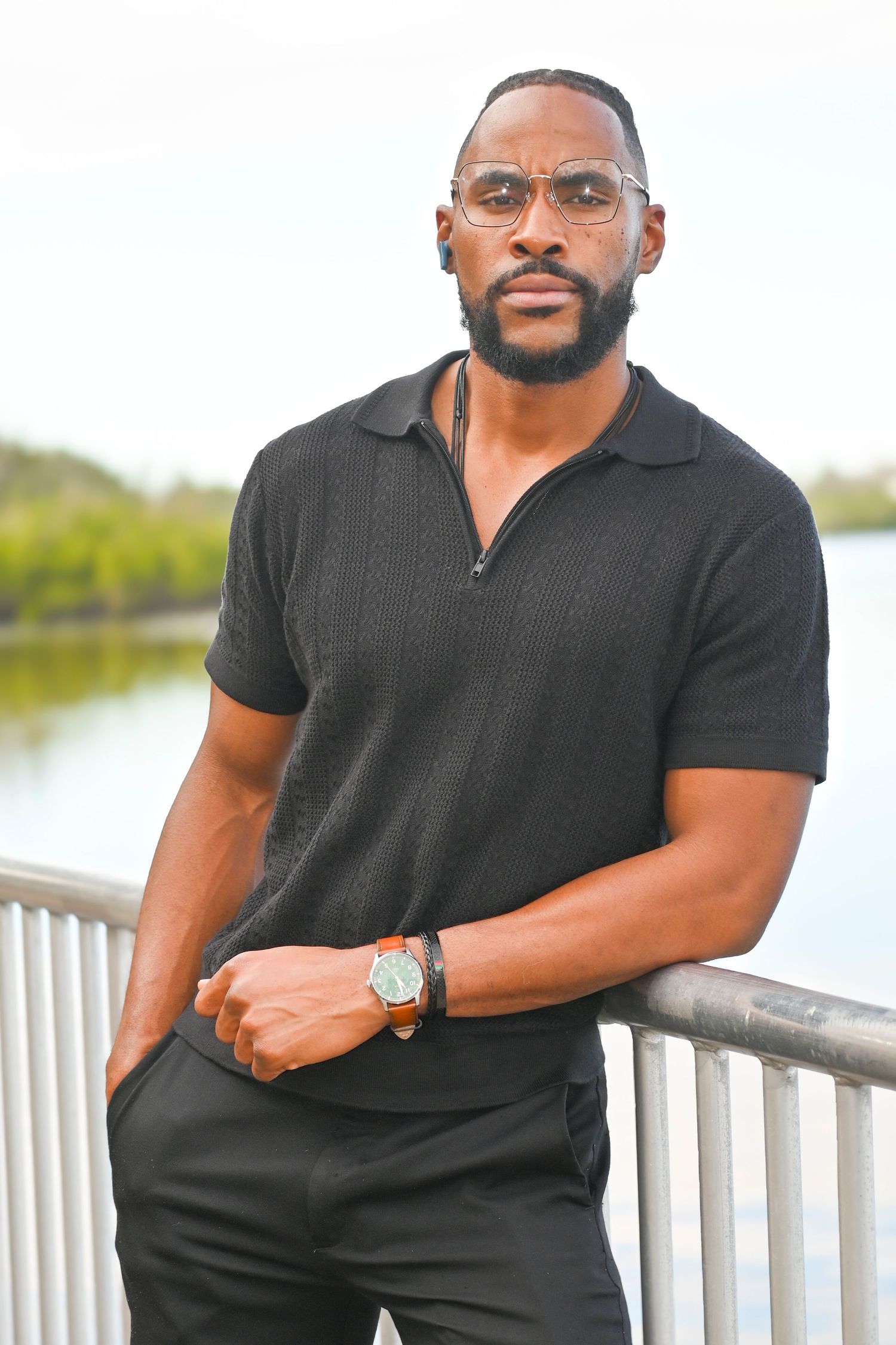 Professional portrait series of person in black polo shirt against outdoor waterfront setting.