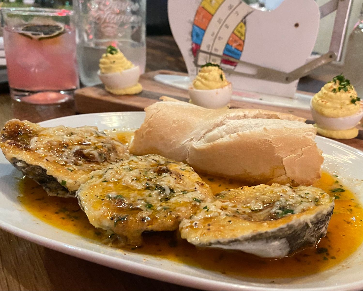 Pan-seared fish fillets in a savory sauce garnished with fresh herbs.