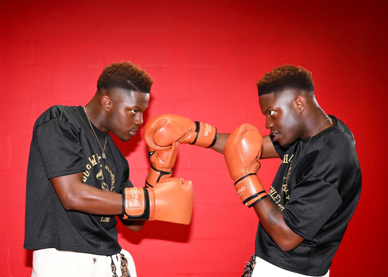 Boxing action shots capture athlete practicing combinations against bright red background.