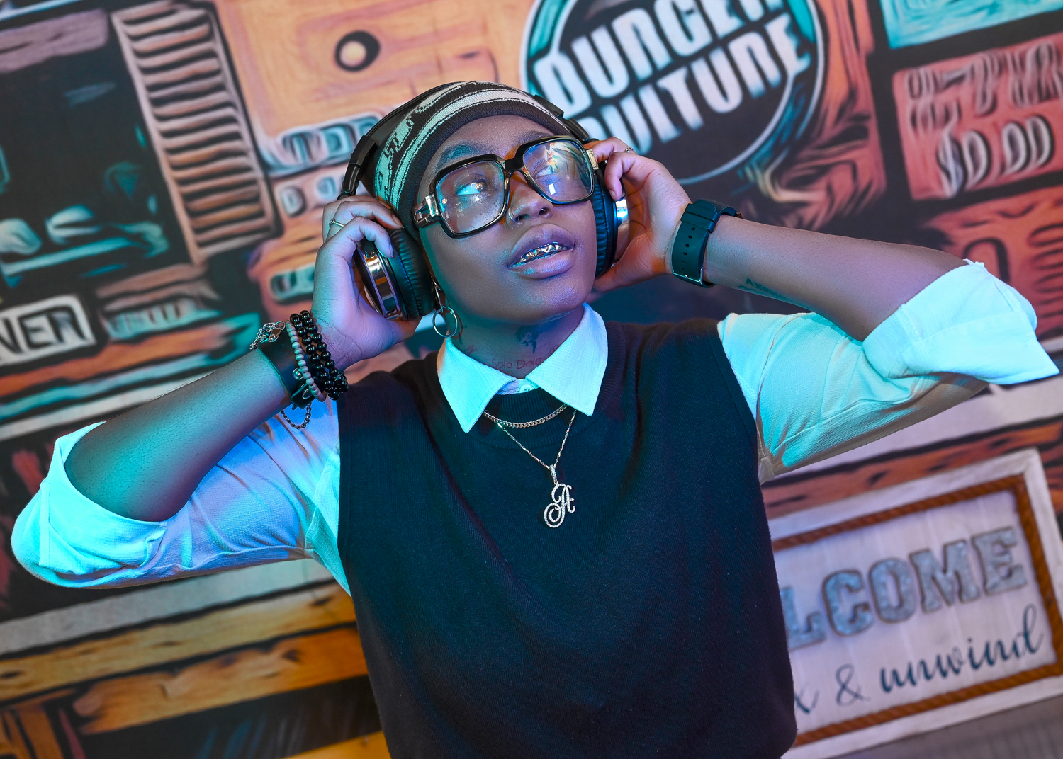 DJ session at a Burger King event with colorful graffiti backdrop.