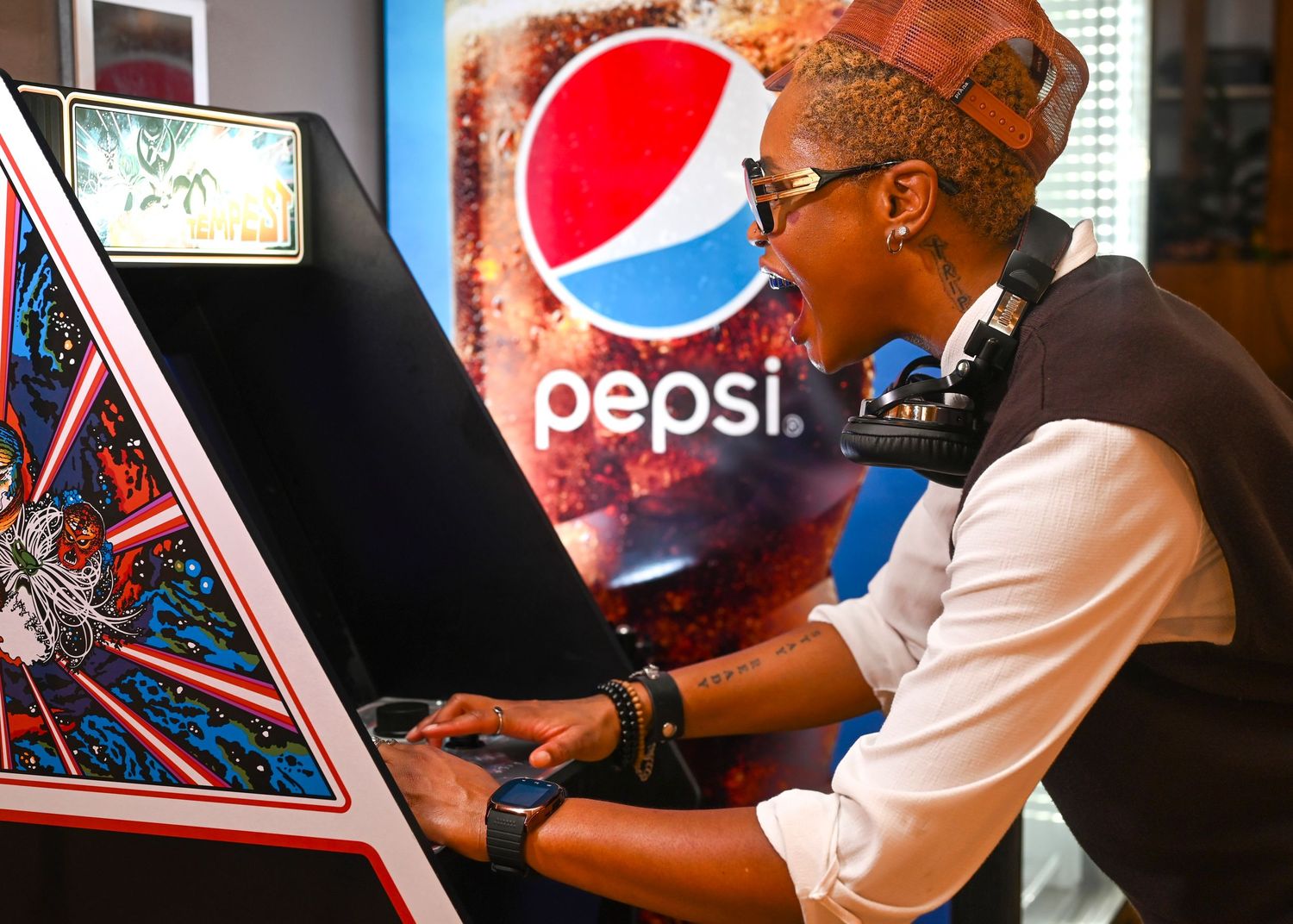 Music mixing session with Pepsi branding and artistic wall decorations.