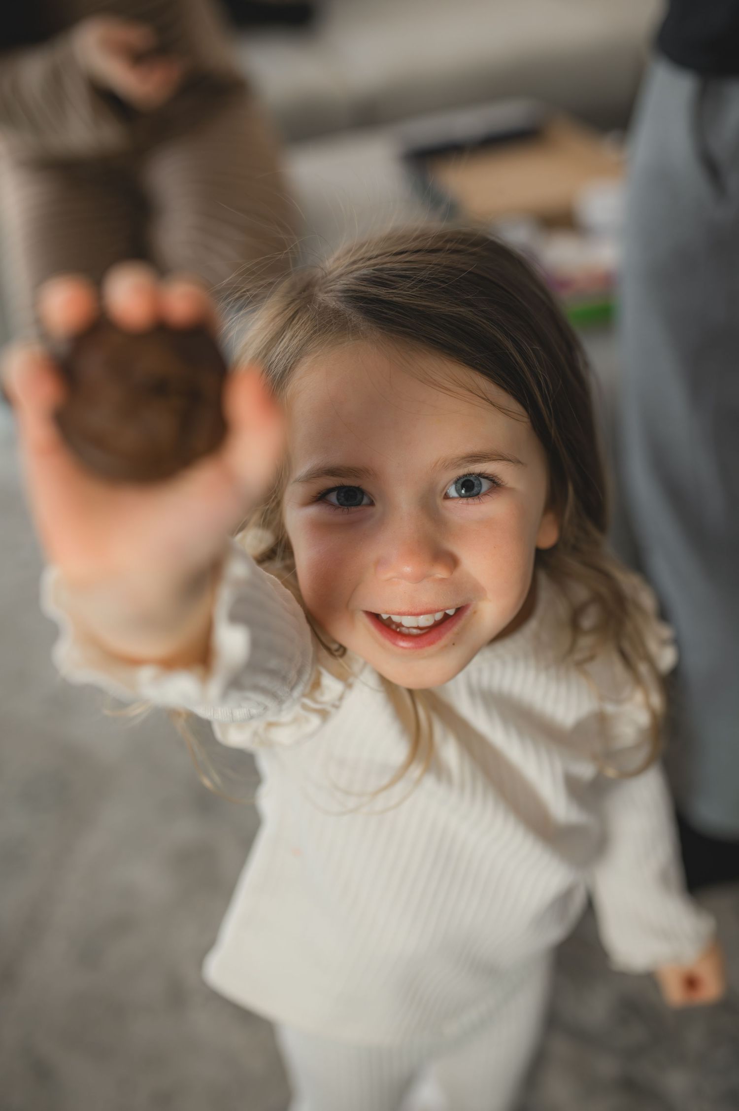 holding play dough to the camera, greenville, nc