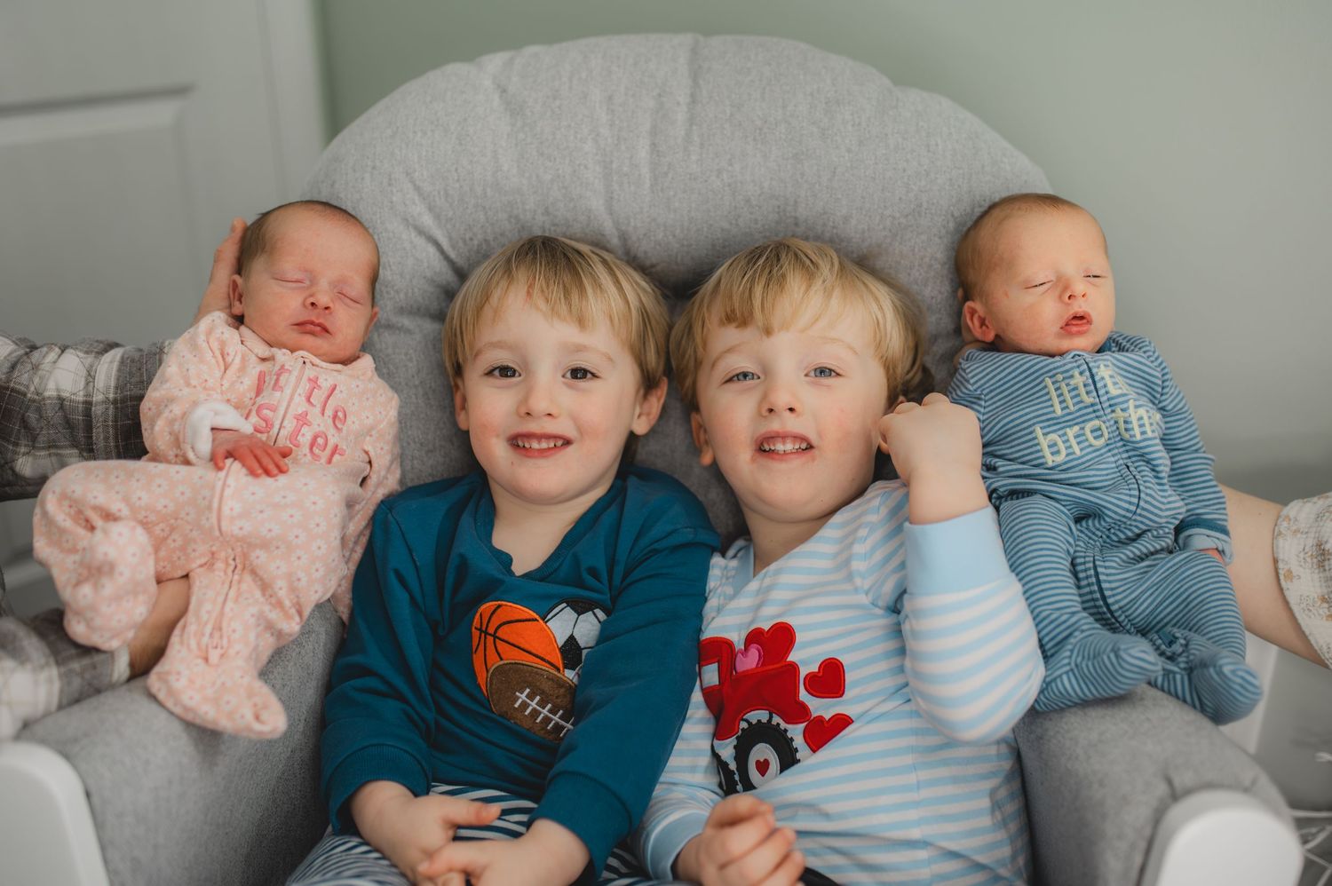 twin babies and twin toddlers sitting in rocking chair, greenville nc newborn photographer