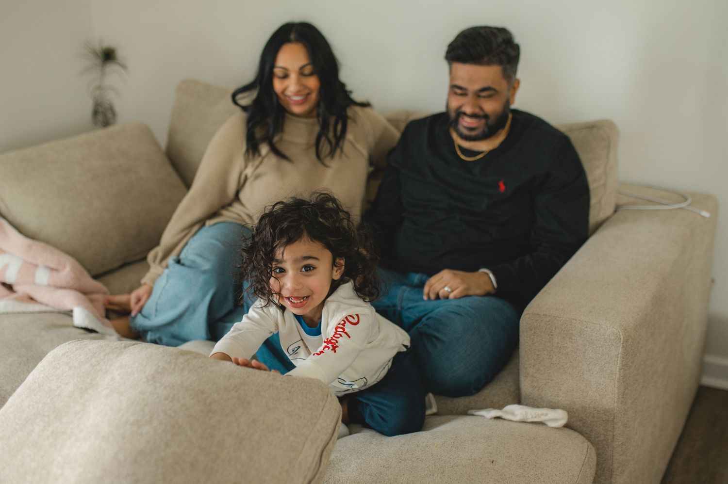 mom dad son, playing on couch with cushions, family at home family photography session, documentary family session