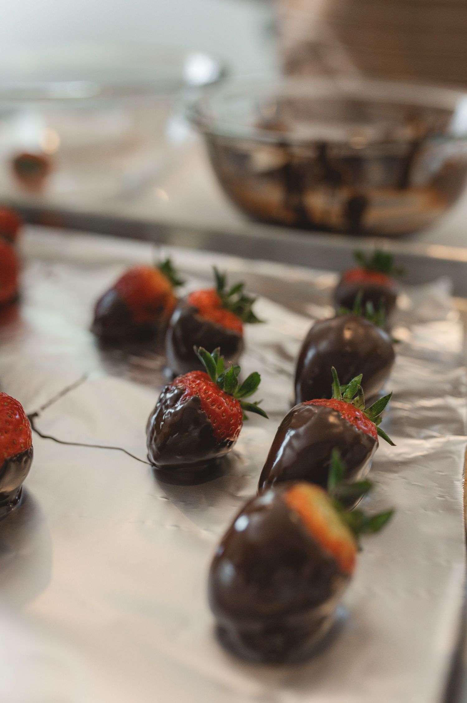 chocolate covered strawberries on tray with parchment paper underneath, greenville, nc