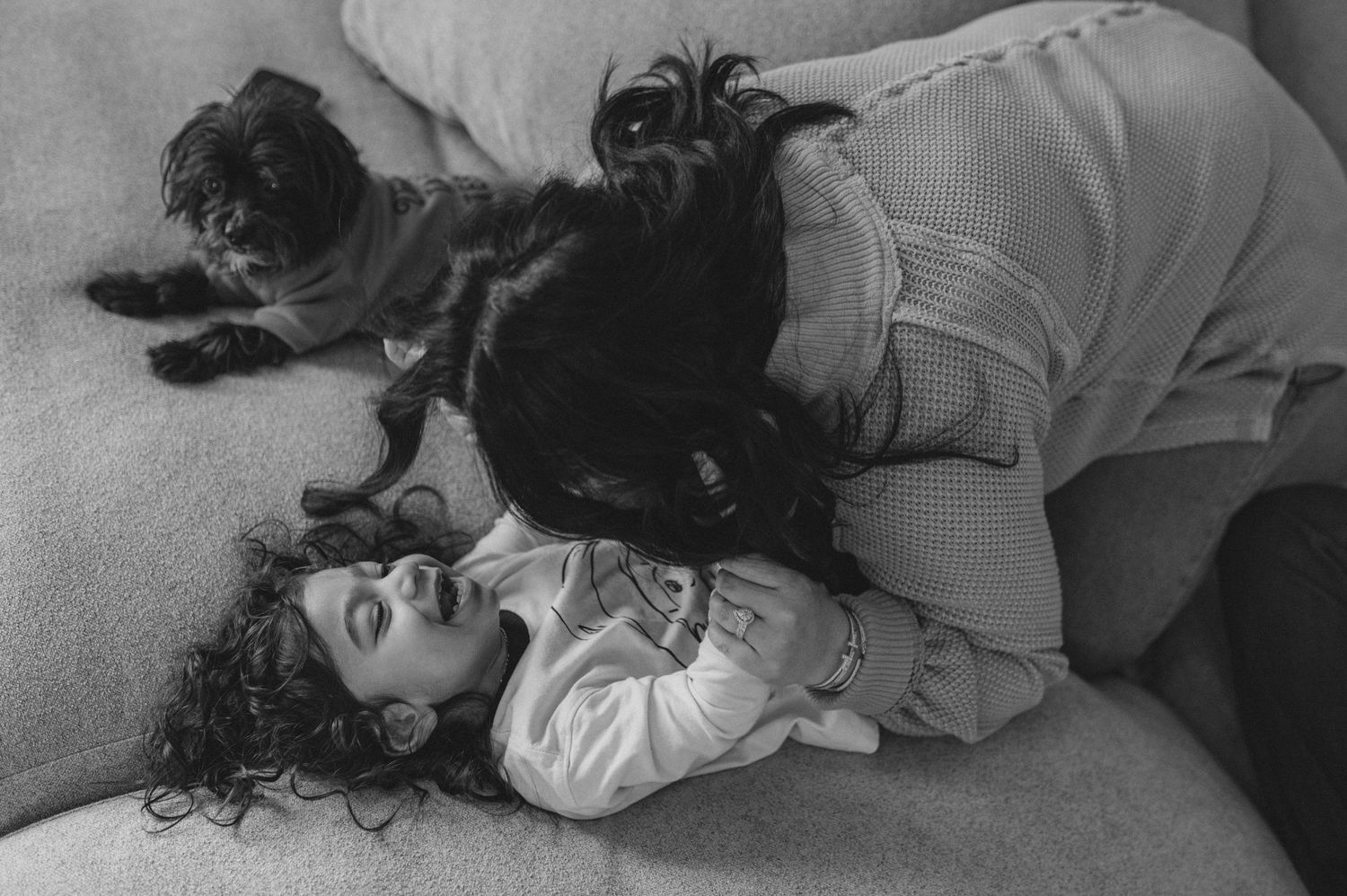 mom dad son, playing on couch with cushions, family at home family photography session, documentary family session