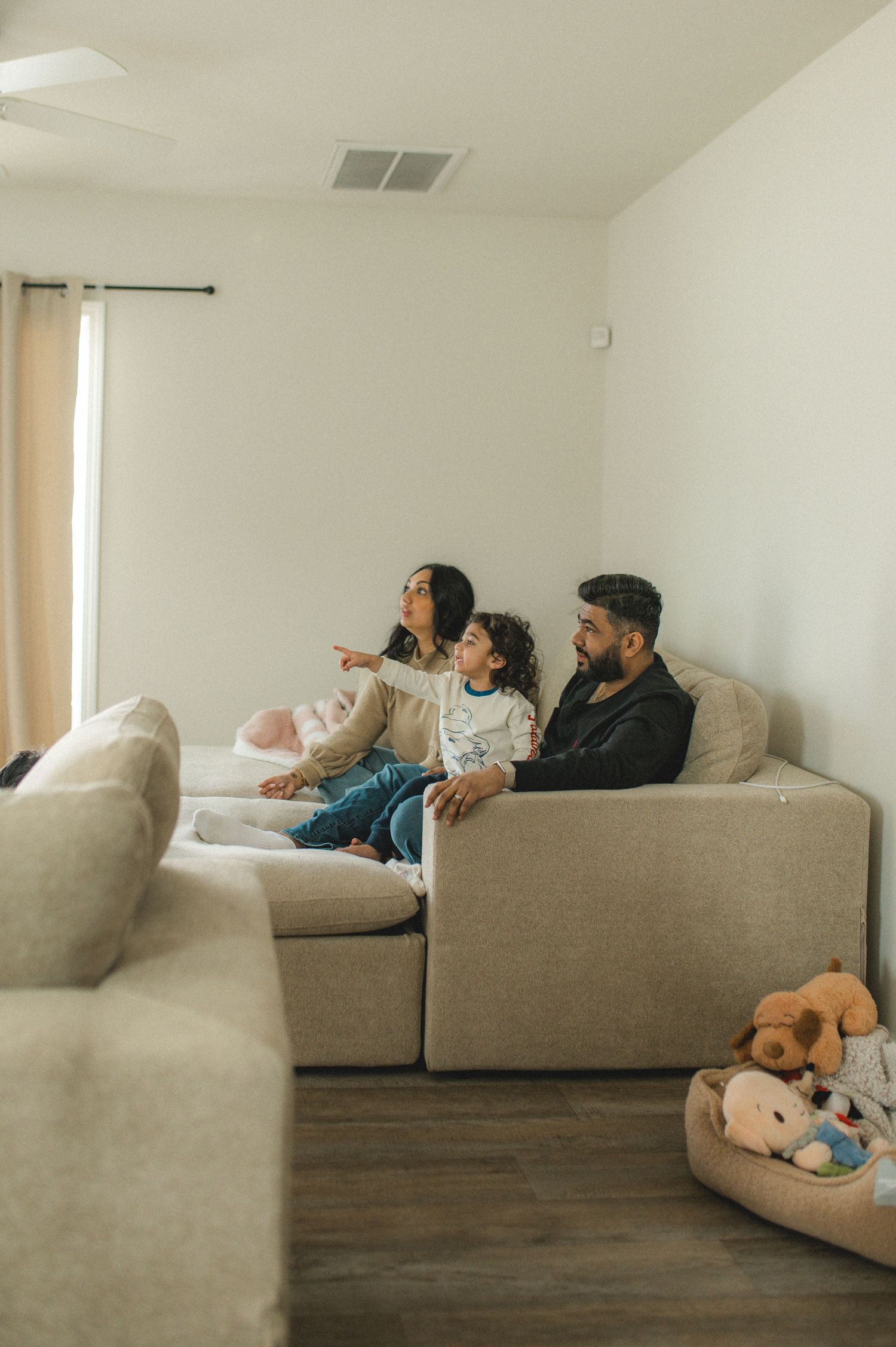 mom dad son, playing on couch with cushions, family at home family photography session, documentary family session