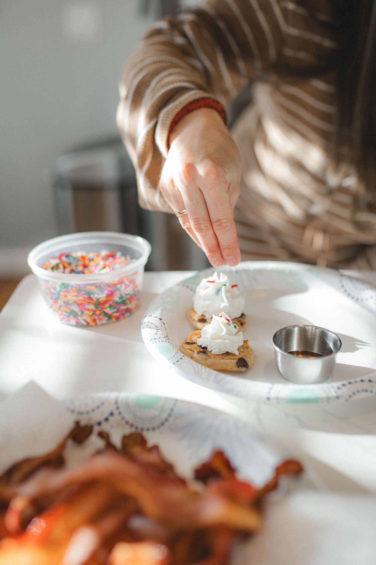 putting sprinkles on chocolate chip pancakes, greenville, nc