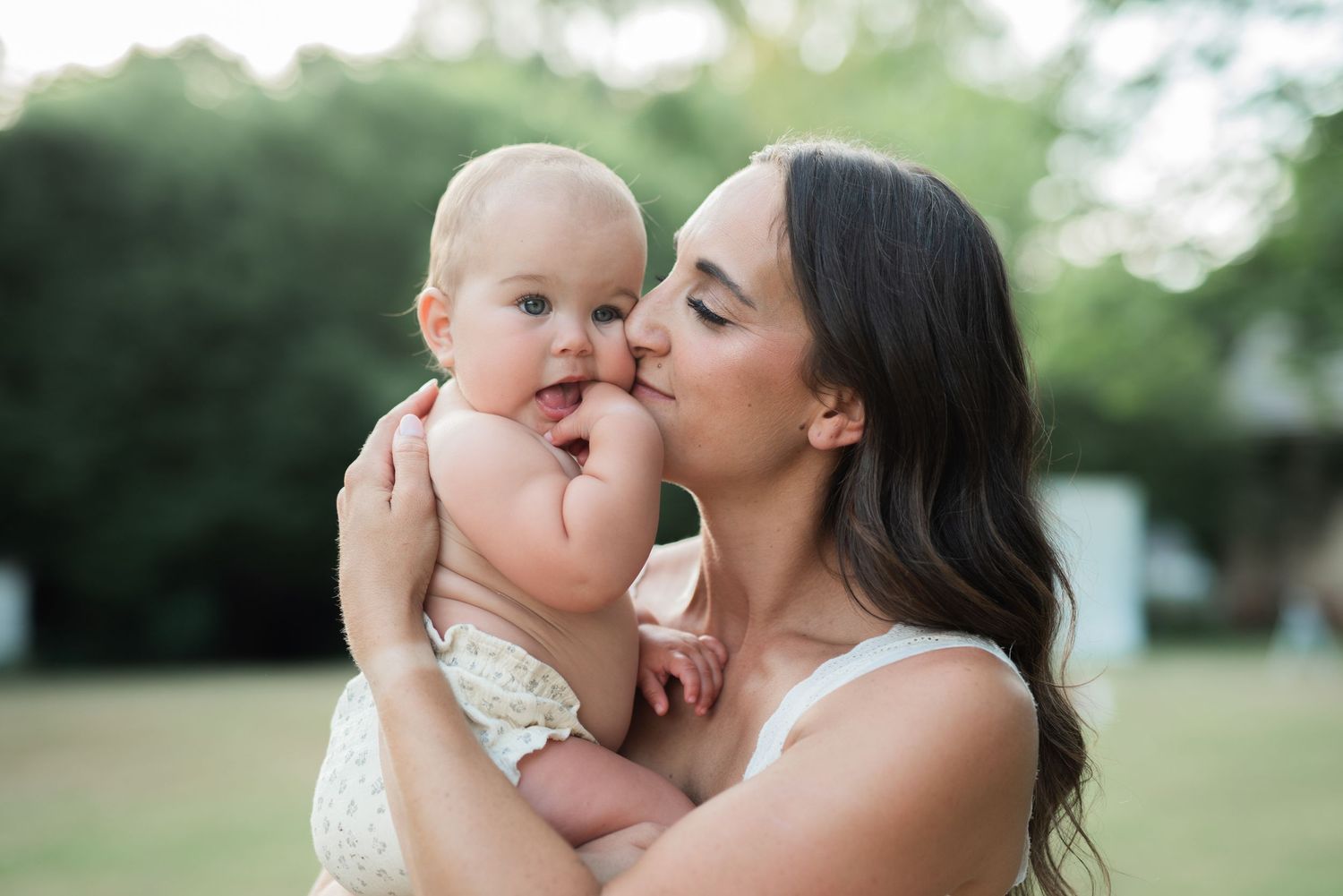 mom and baby outside hugging