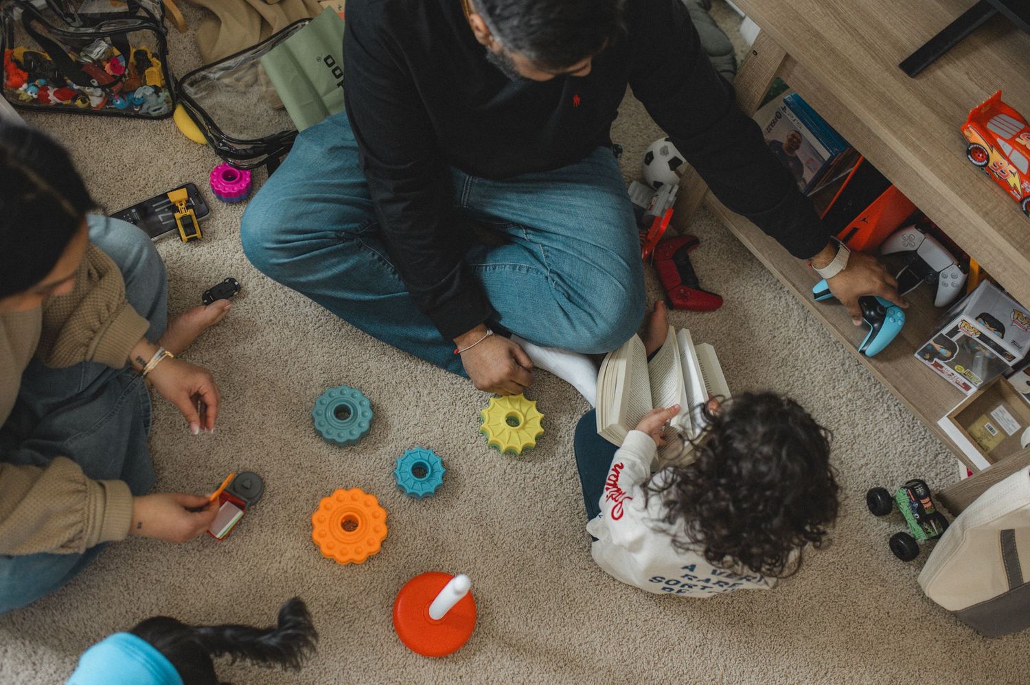 mom dad son playing reading at home, family session, documentary family photographer
