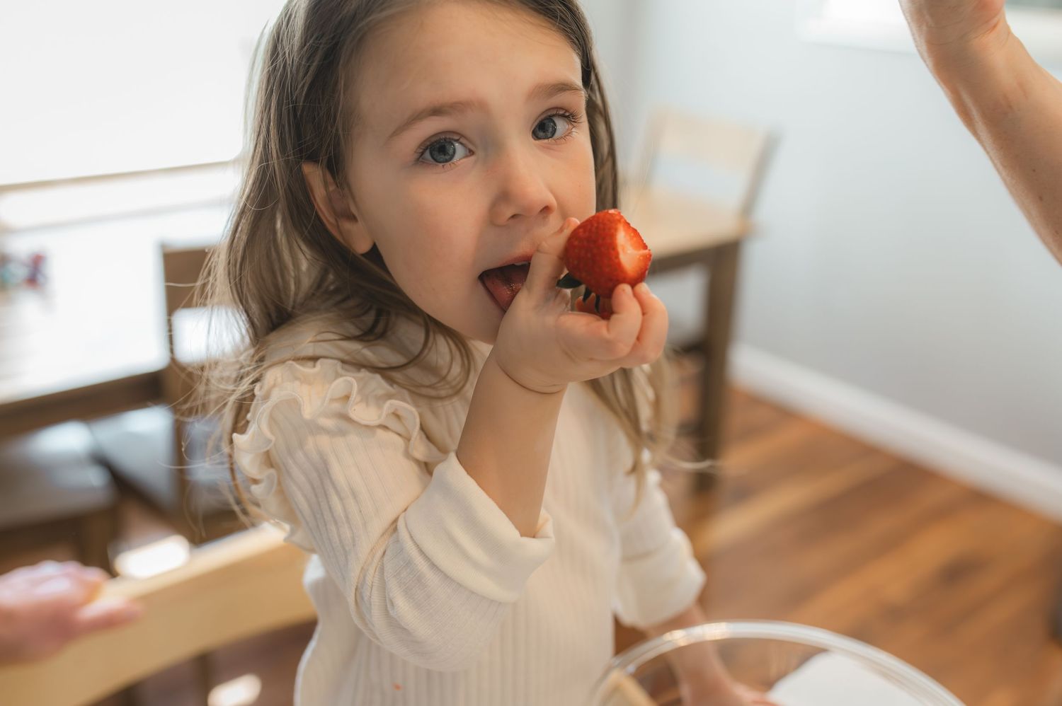 child eating chocolate covered strawberry, greenville, nc
