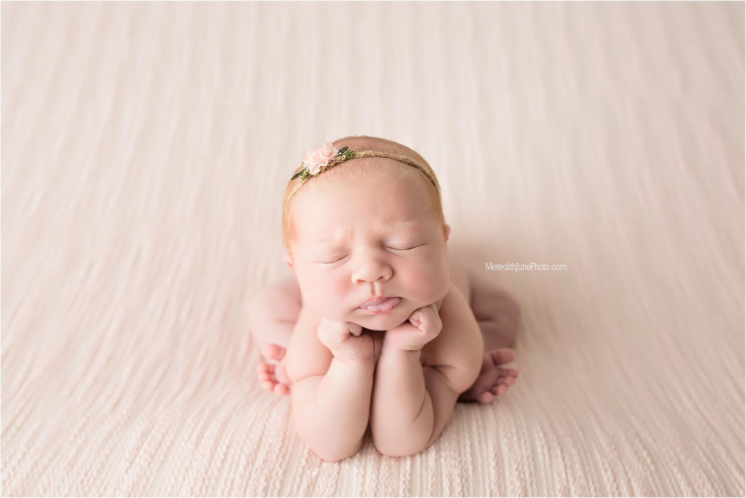 A series of minimalist newborn baby photos on soft cream fabric showing tiny feet, hands, and curled up poses.