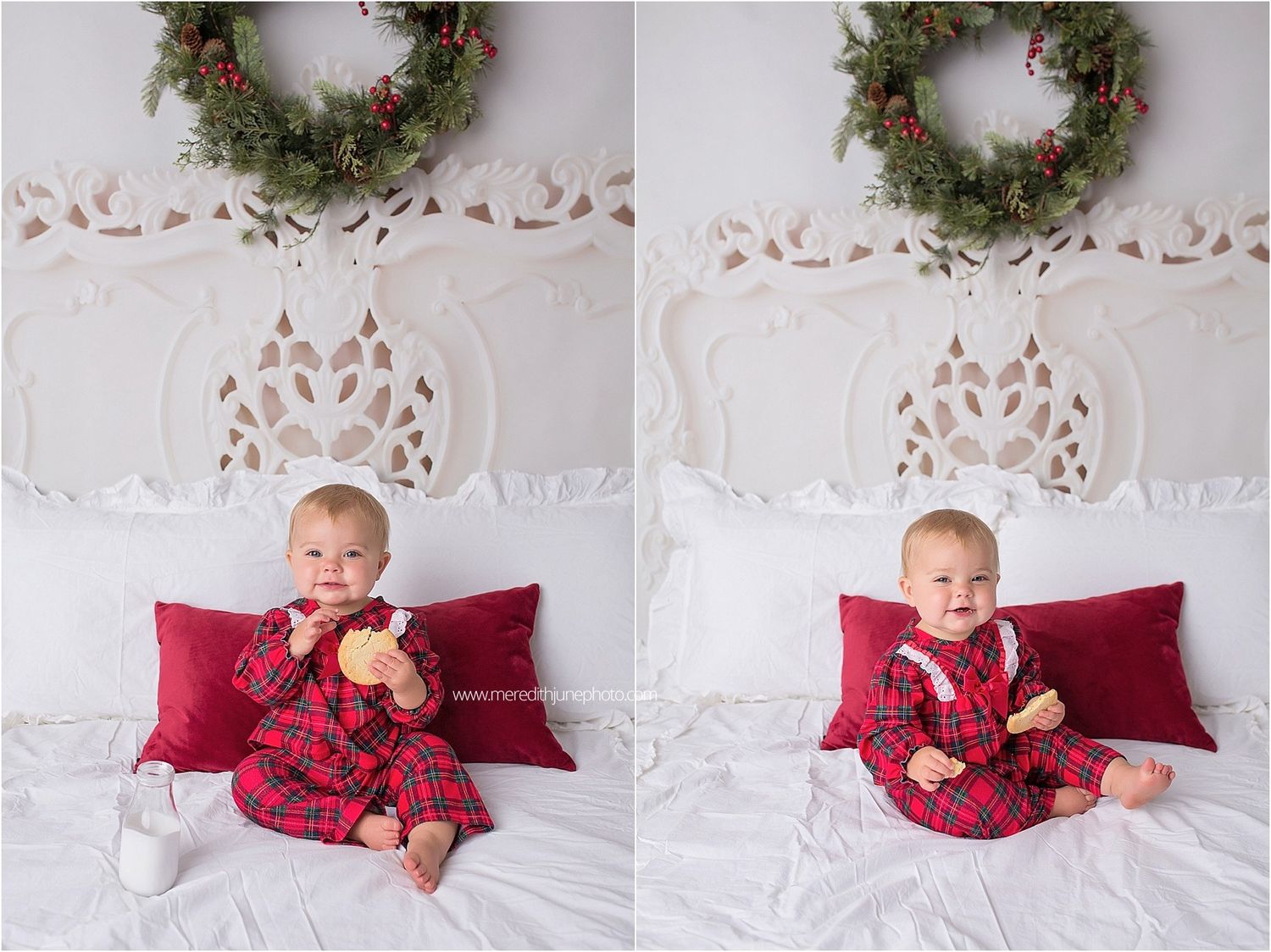 Holiday portrait setup with green wreath, red pillows and white bedding against decorative wall backdrop.