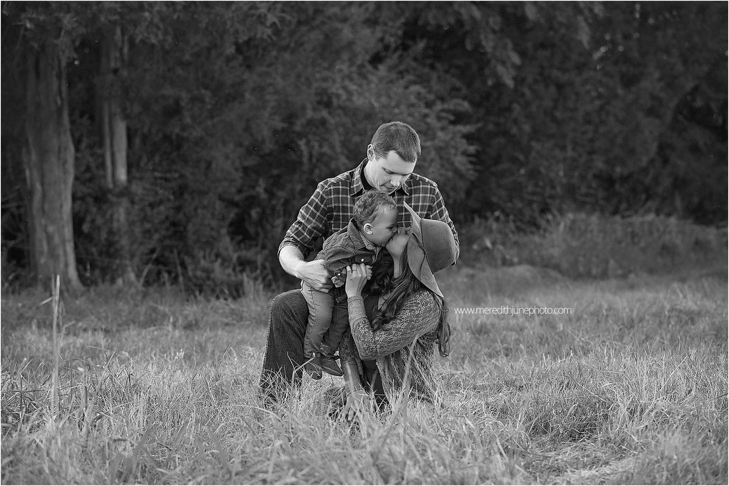 Black and white series of romantic couple portraits captured in a rustic outdoor setting.