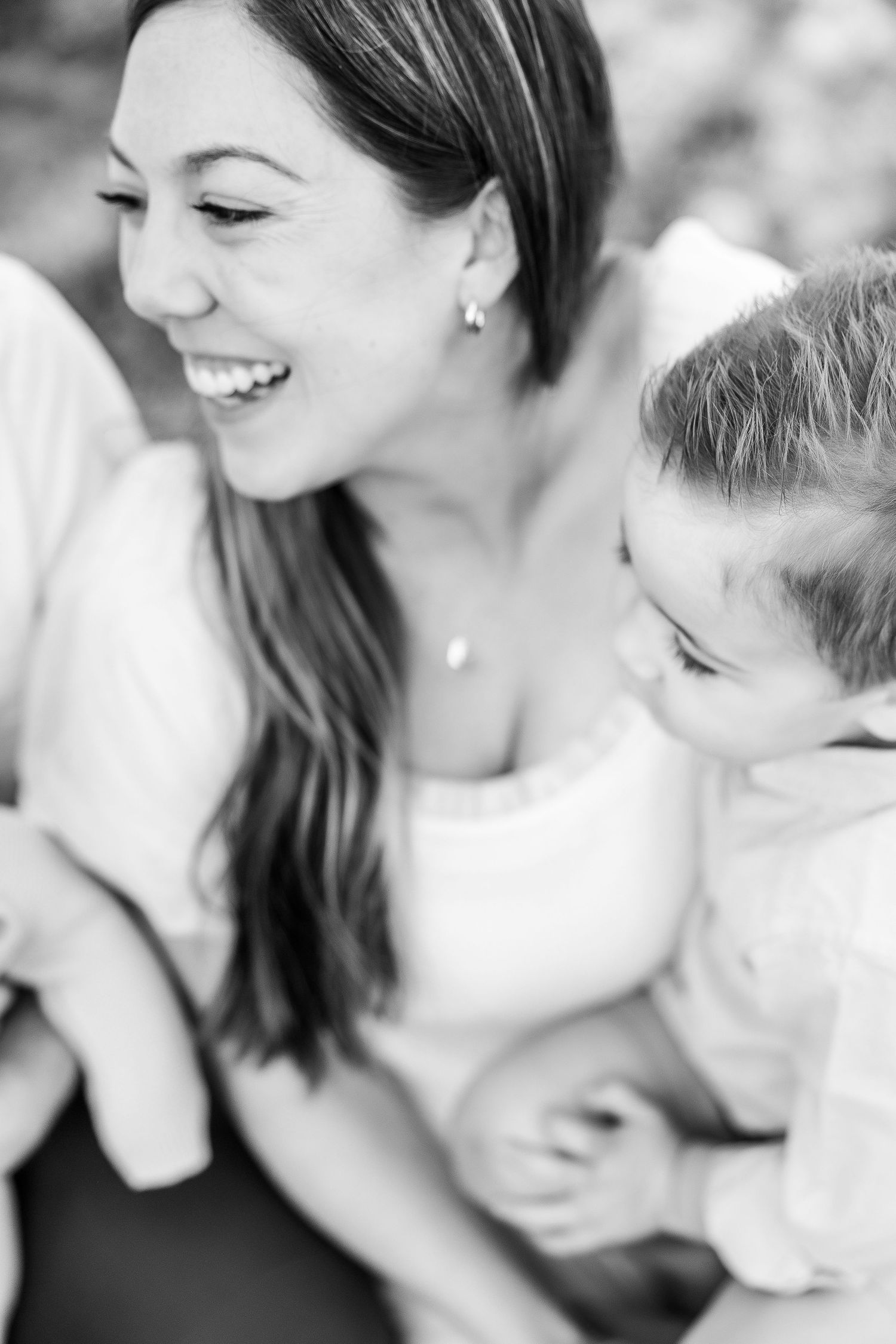 Black and white close-up shots showing tender emotional moments between a couple.