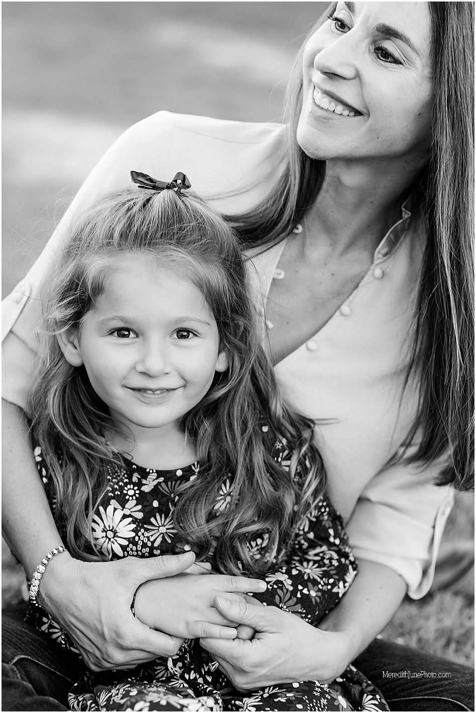 Black and white candid lifestyle photography series showing tender moments between parent and child outdoors.
