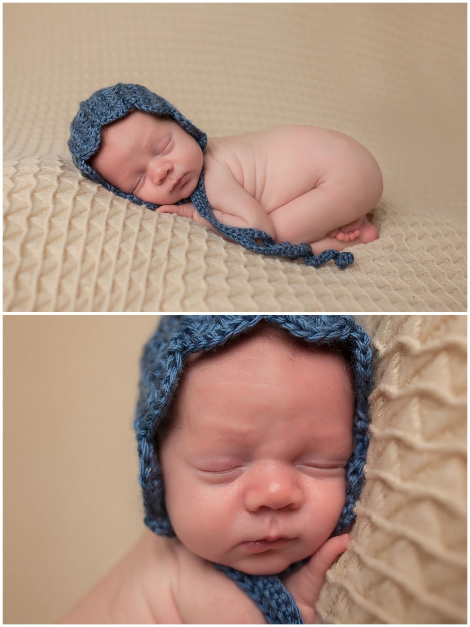 Sleeping newborn wearing blue knit bonnet curled up in fetal position on textured beige blanket in professional portrait.